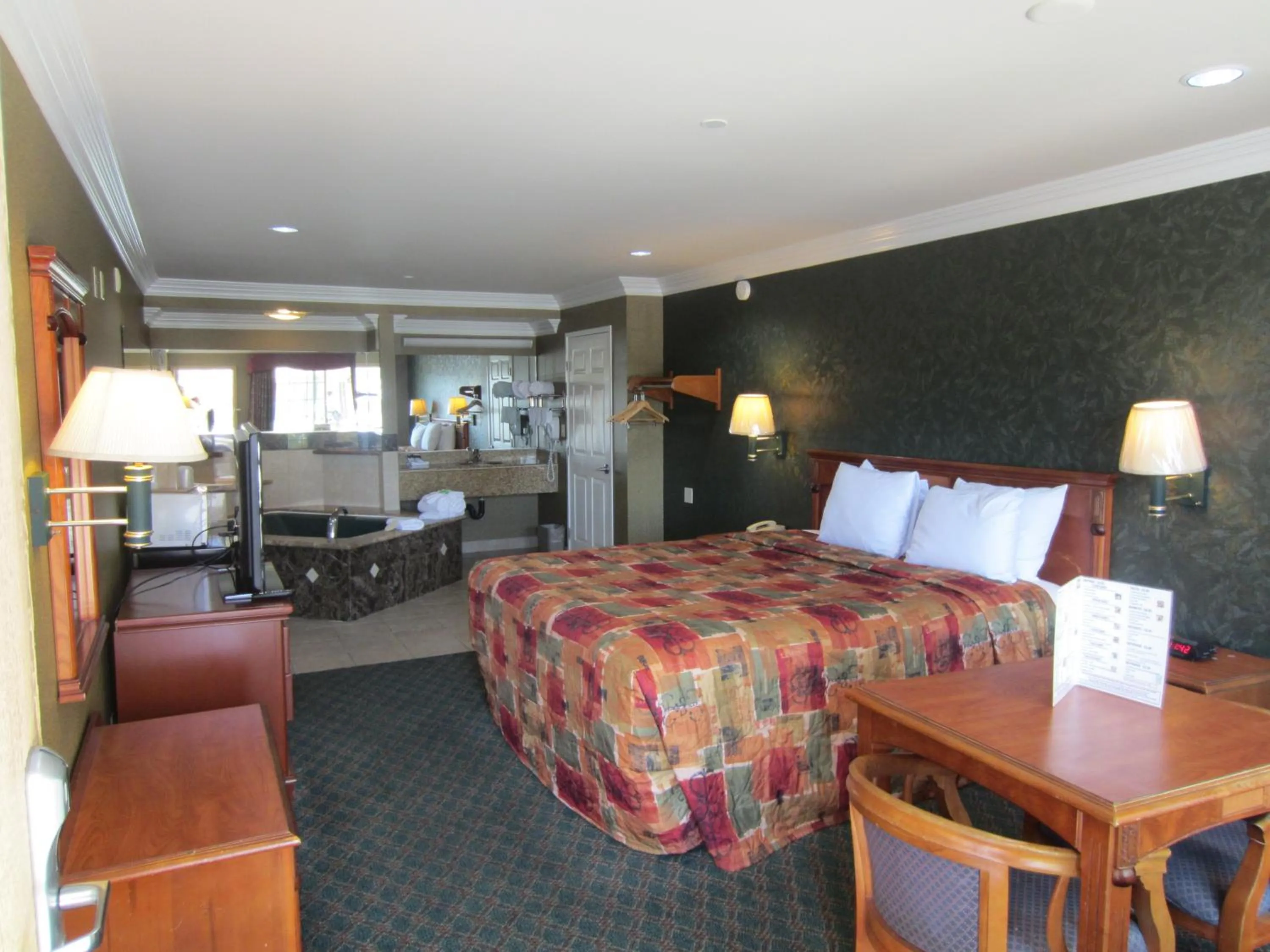 Bed in Crystal Inn Suites & Spas