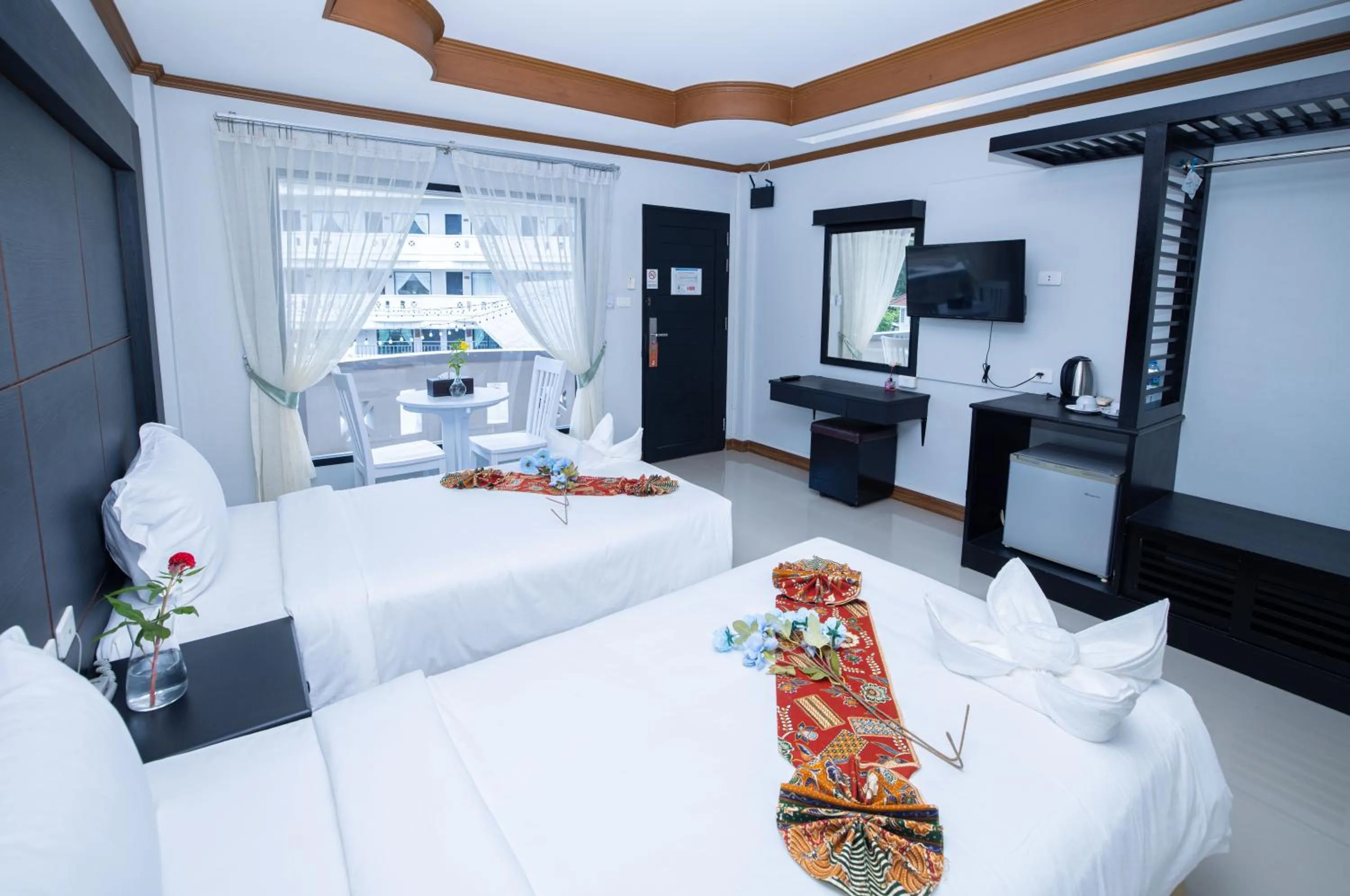 Communal lounge/ TV room, Bed in Blue Carina Hotel Phuket