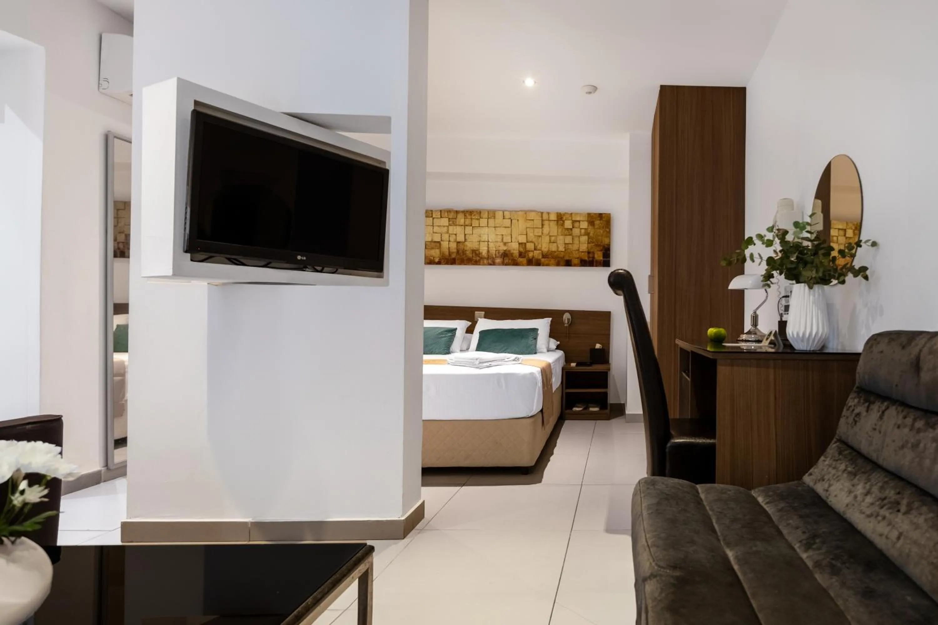 Living room, Bed in Achilleos City Hotel