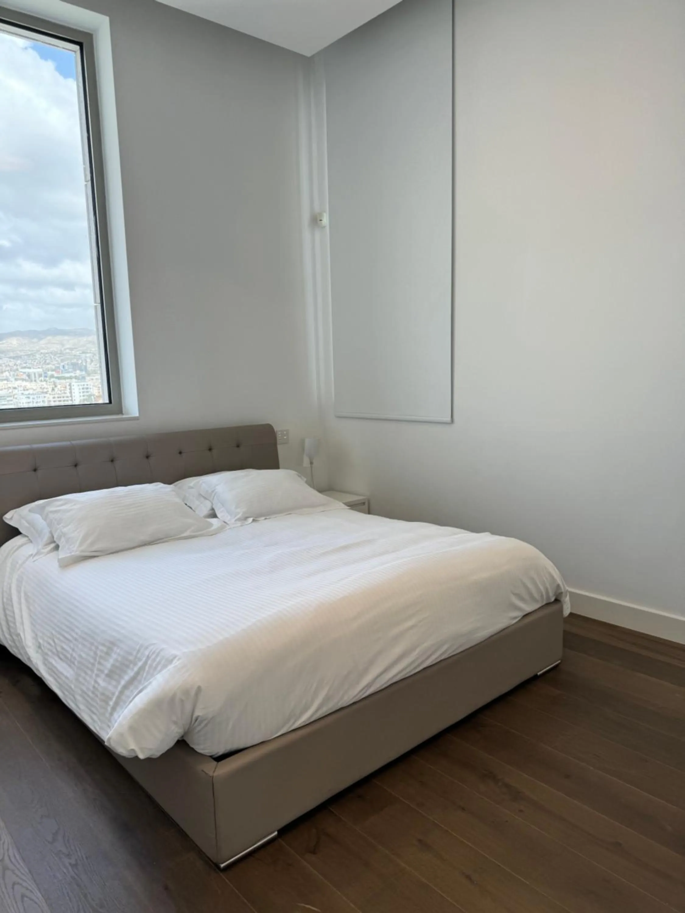 Bed in Olympic Residence Deluxe Apartments