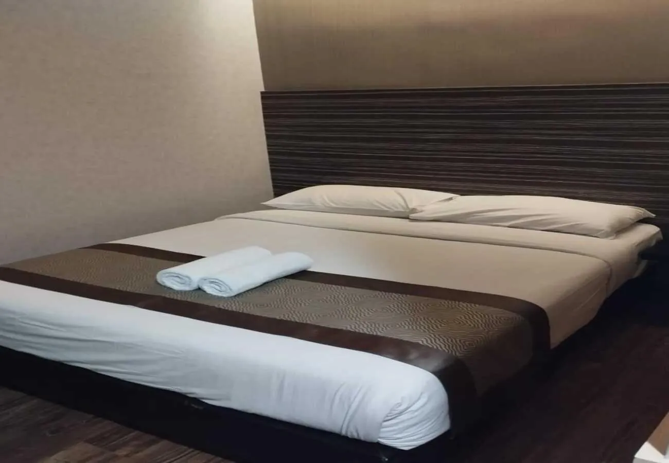 Bed in Hotel Austin Paradise