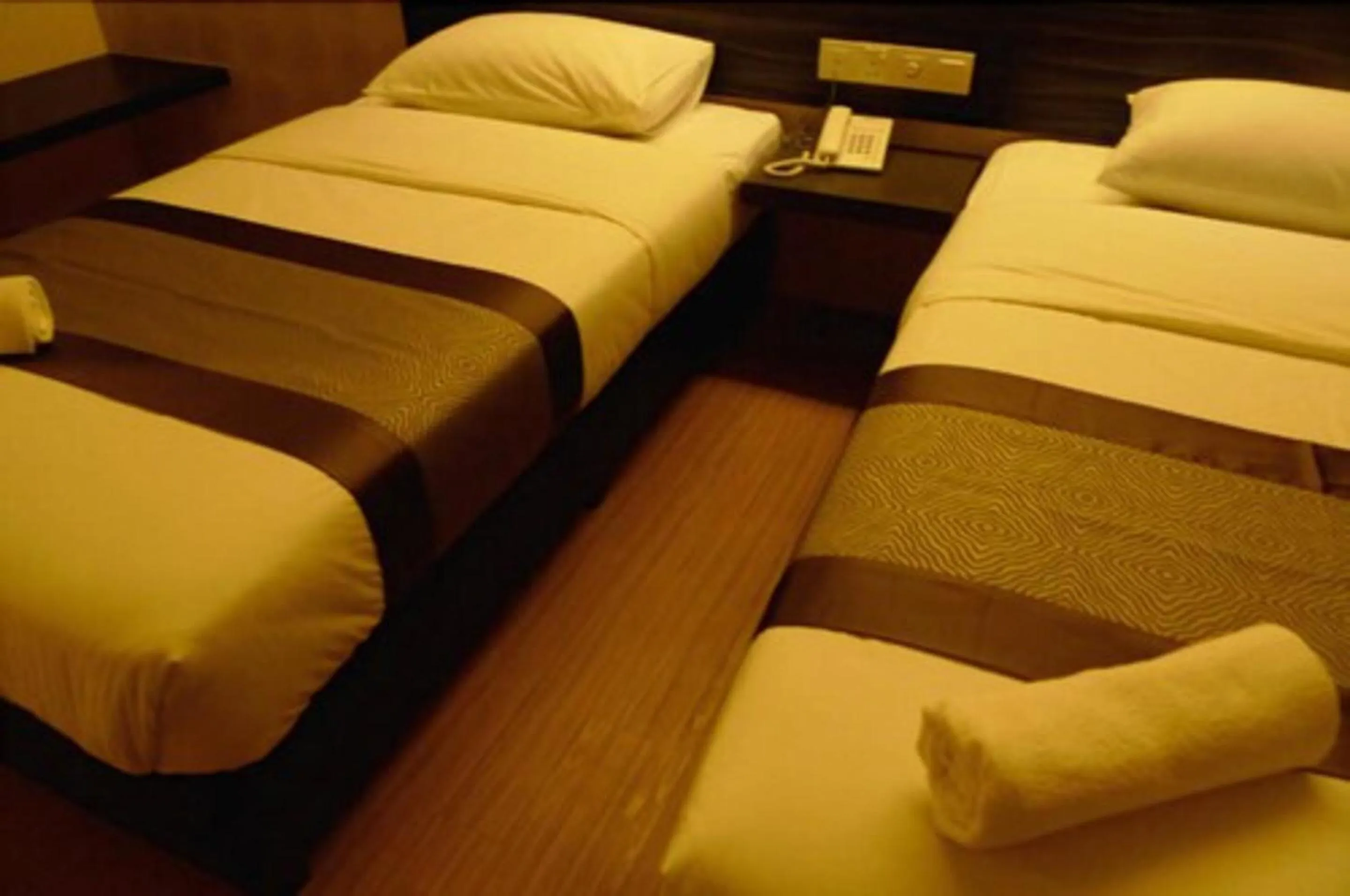 Bed in Hotel Austin Paradise