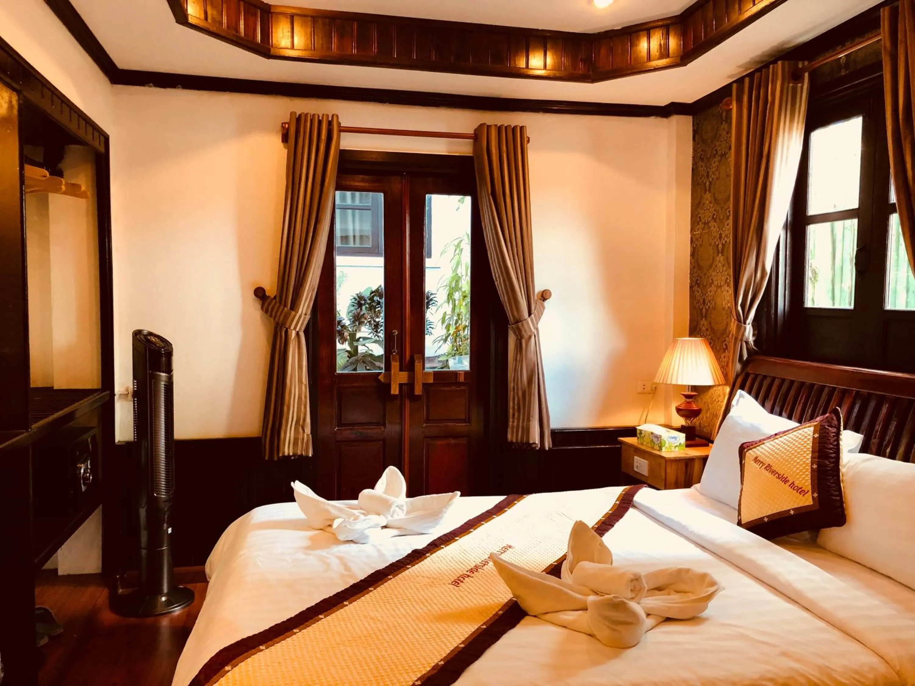 Bed in Merry Riverside Hotel