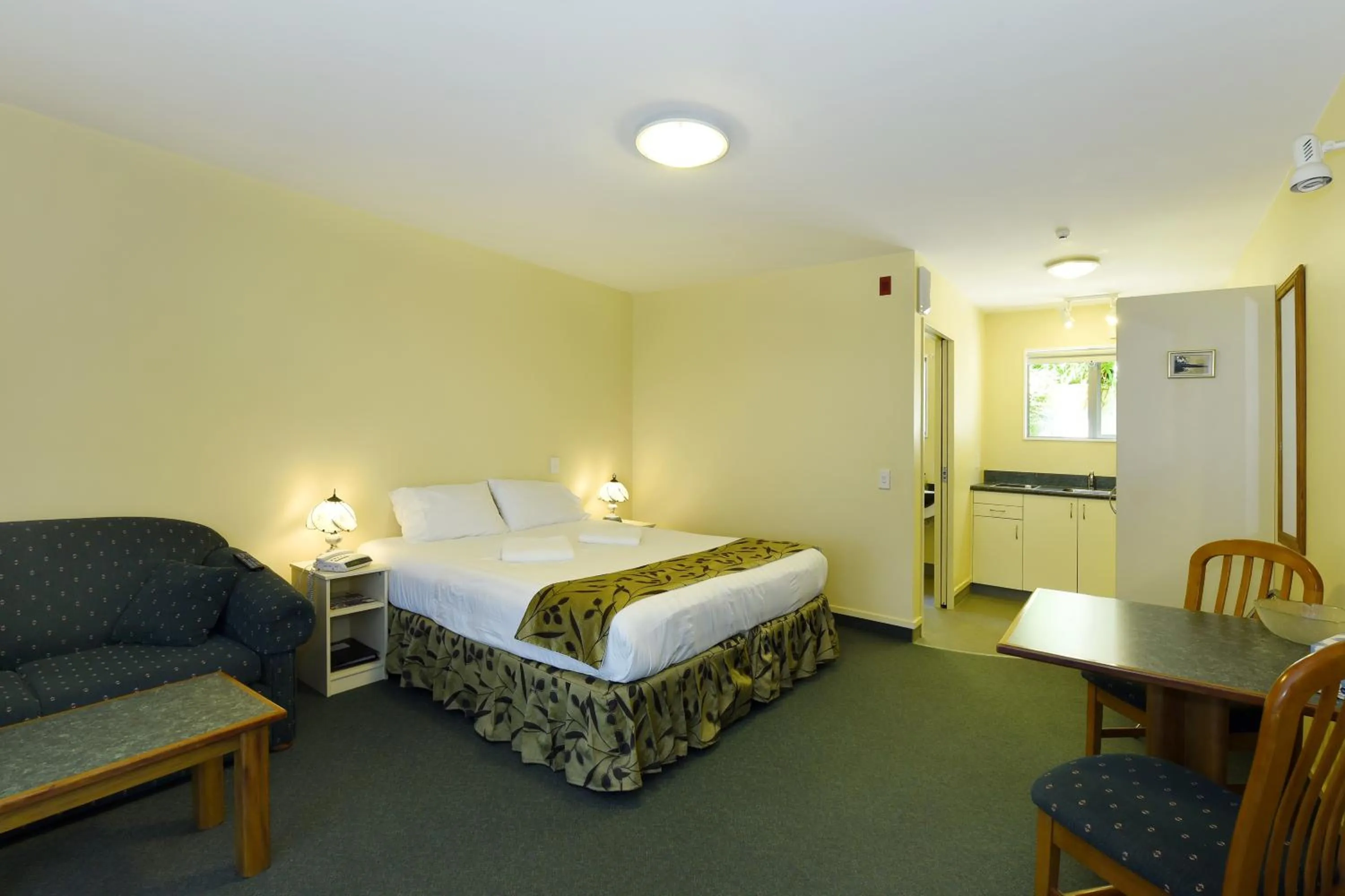 Bed in Abelia Motor Lodge