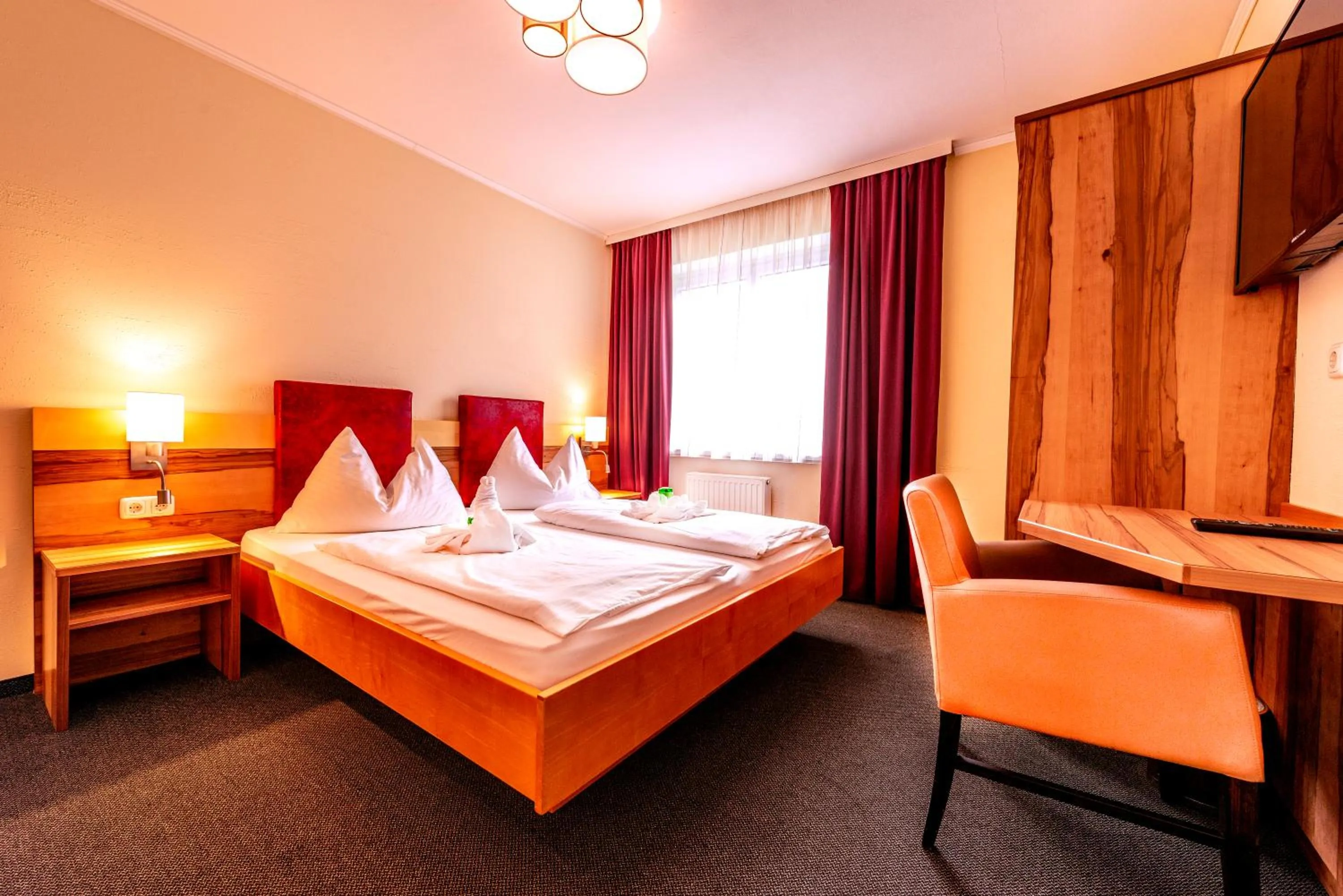 Photo of the whole room, Bed in Panorama Hotel Traunstein