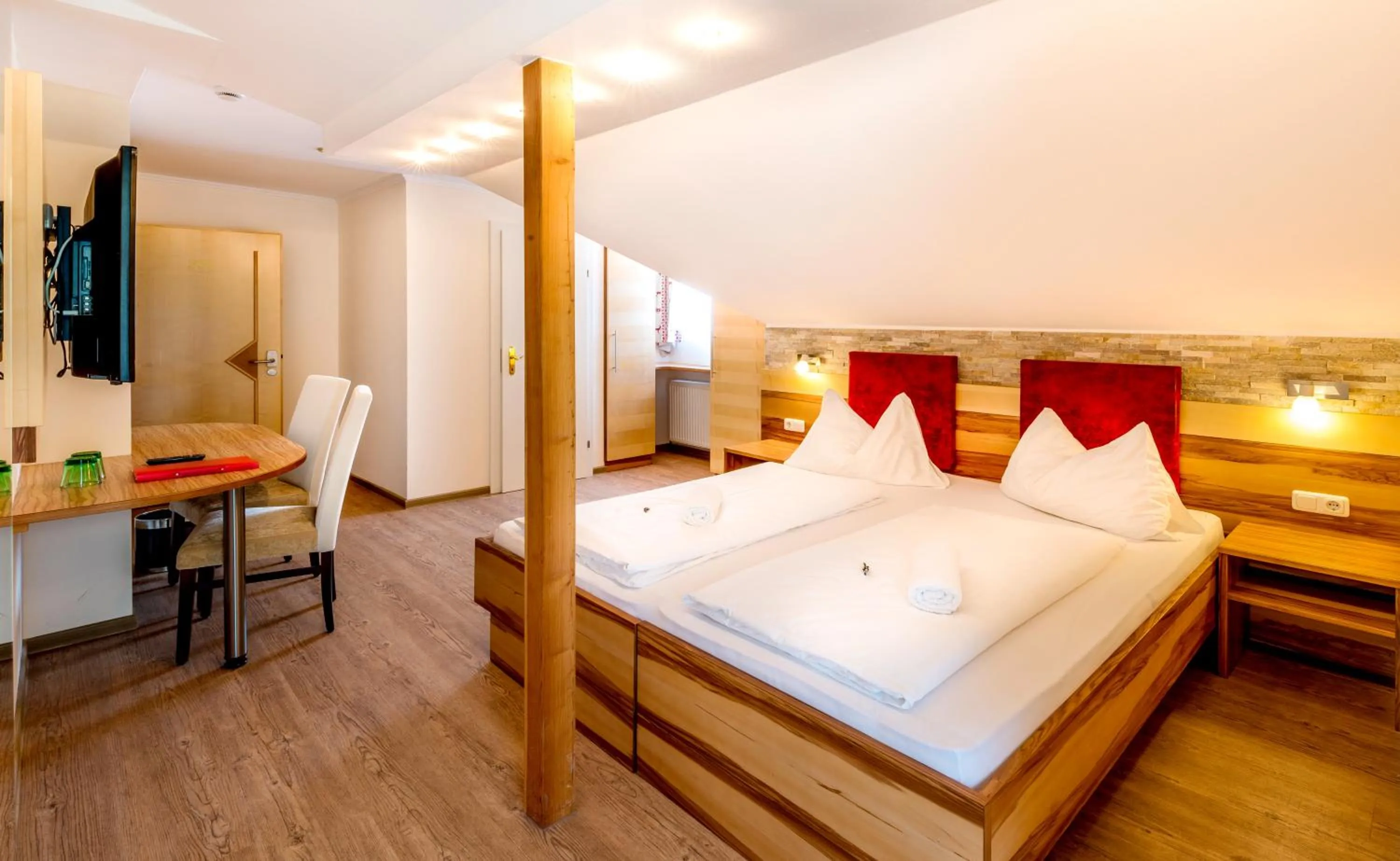 Photo of the whole room, Bed in Panorama Hotel Traunstein