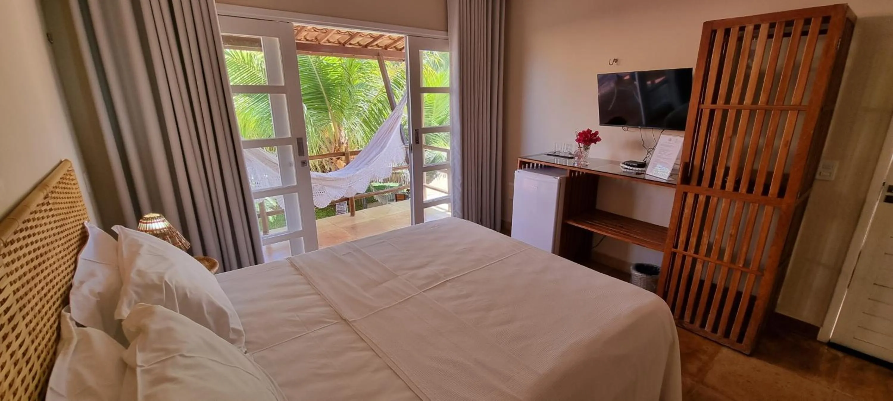 Photo of the whole room, Bed in Pousada Enseada do Gostoso