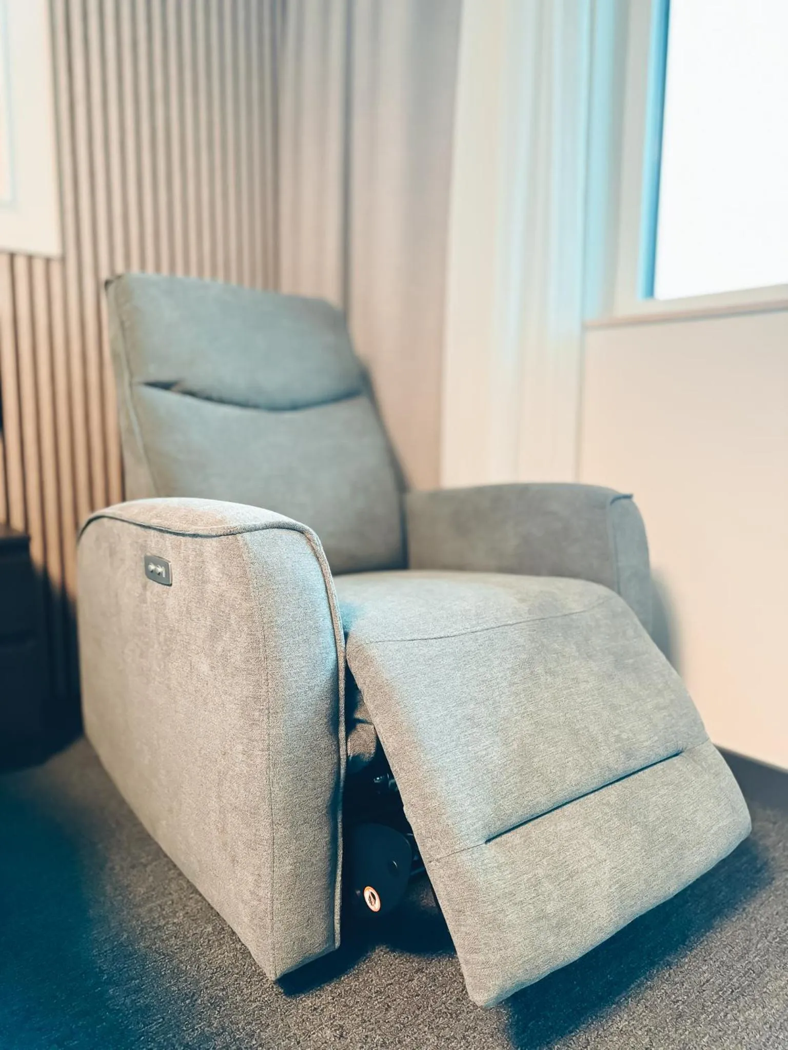 Seating area in F Hotel 24h Check-In