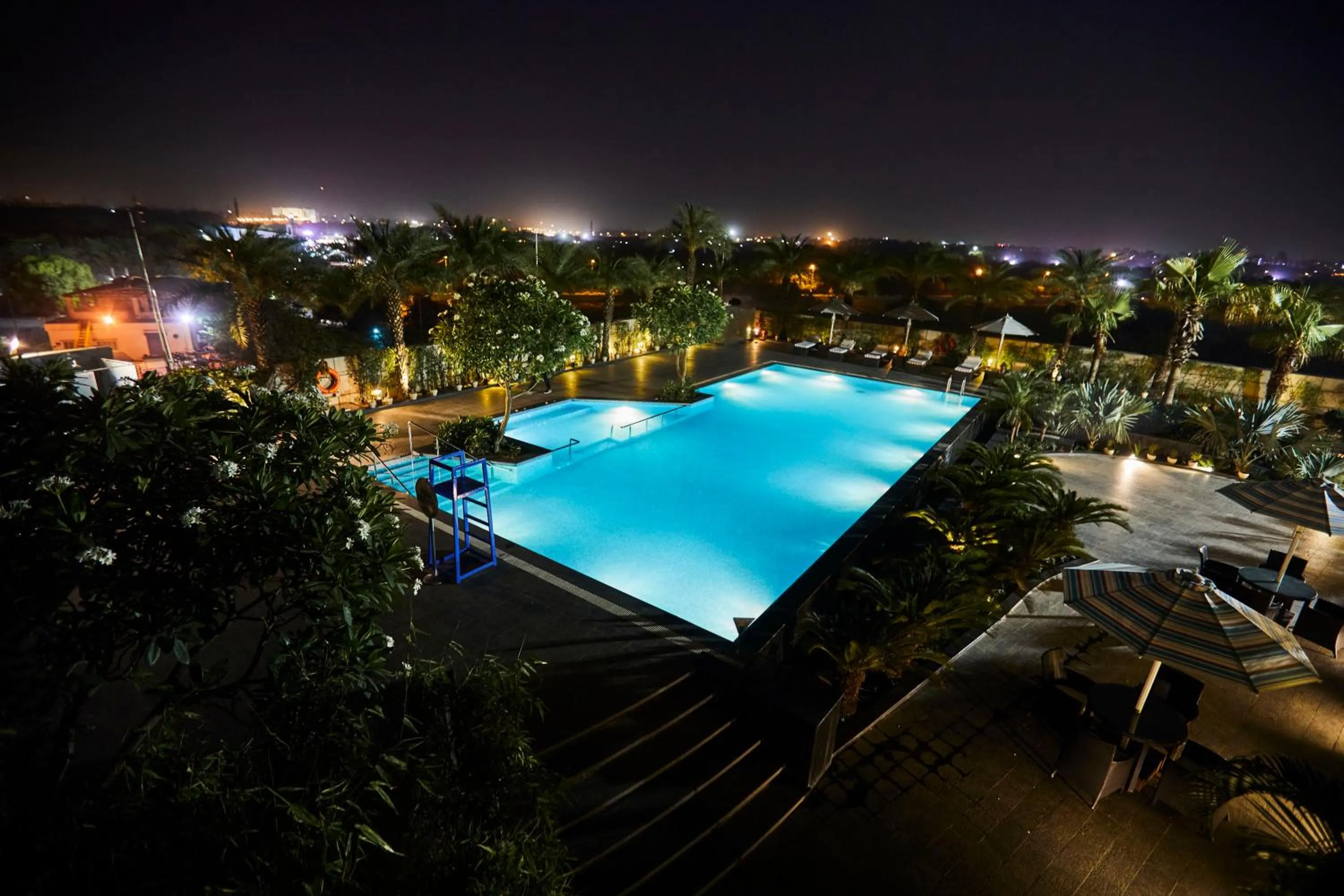 Swimming pool in Crowne Plaza New Delhi Rohini by IHG