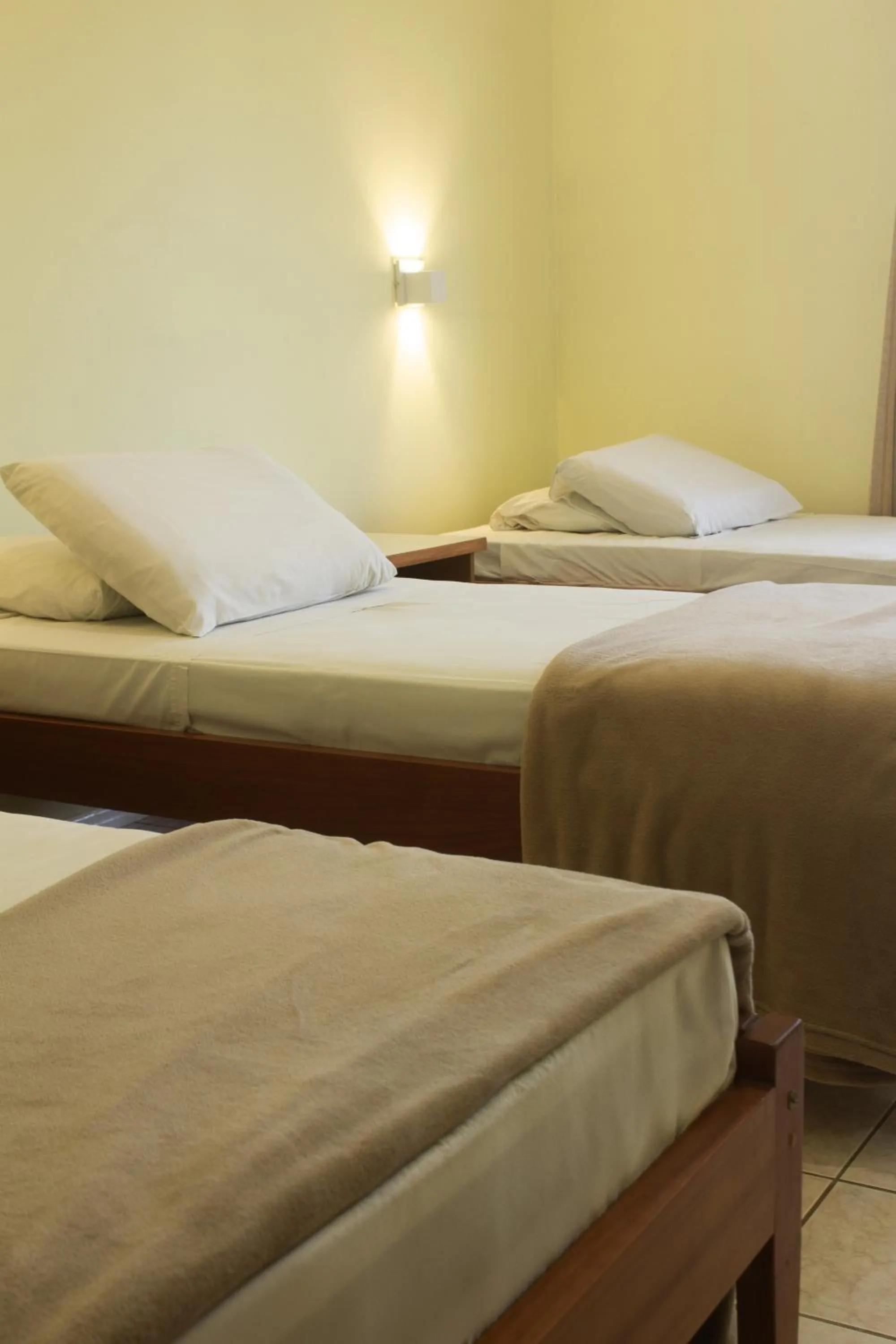 Bed in Hotel Caverá
