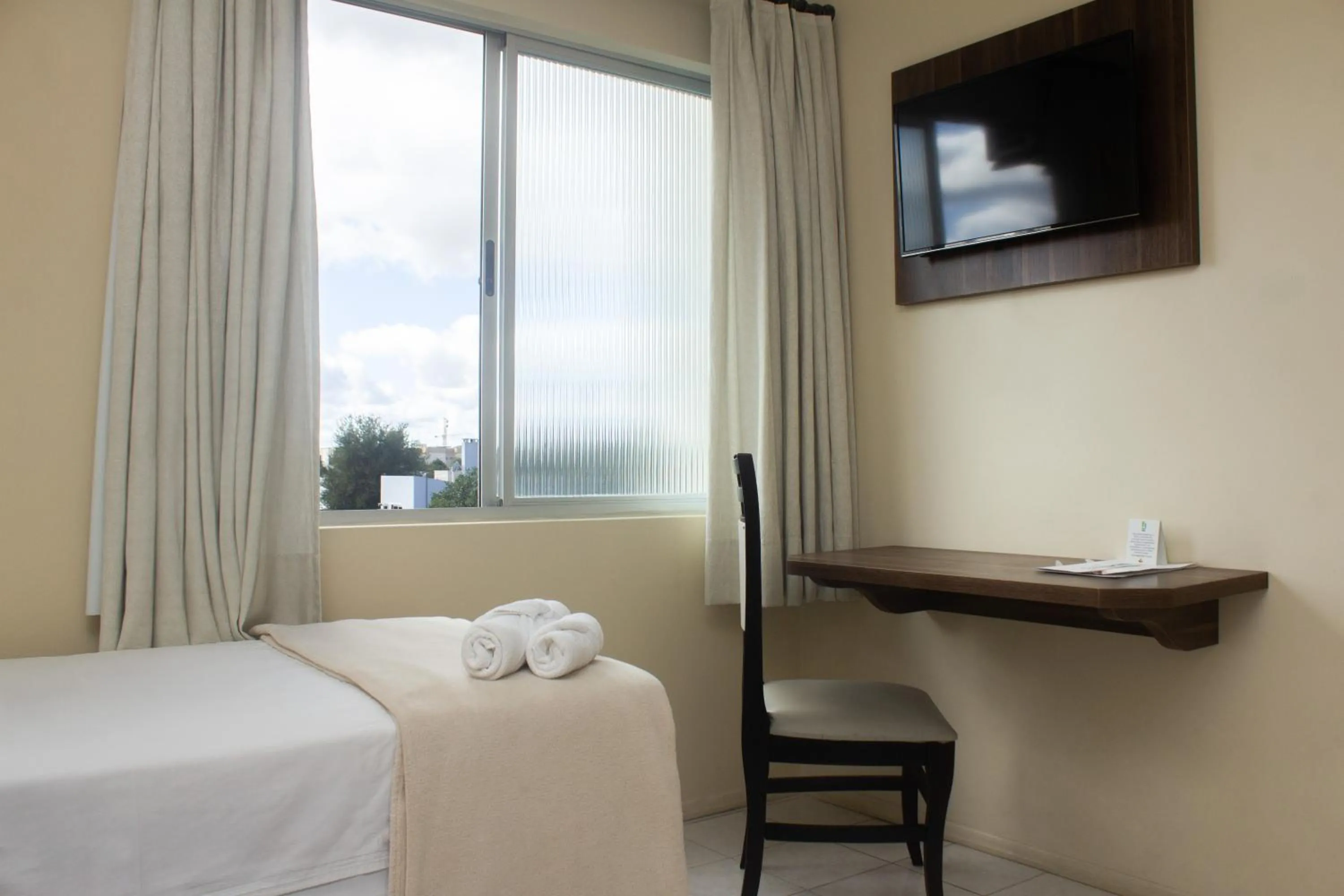 Bed in Hotel Caverá