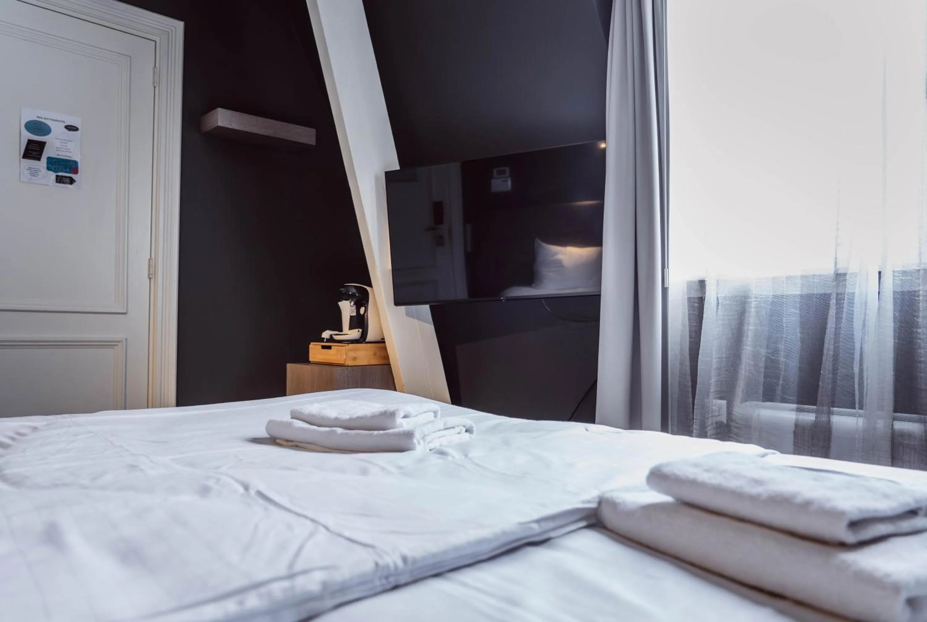 Bed in Tres Boutique Hotel