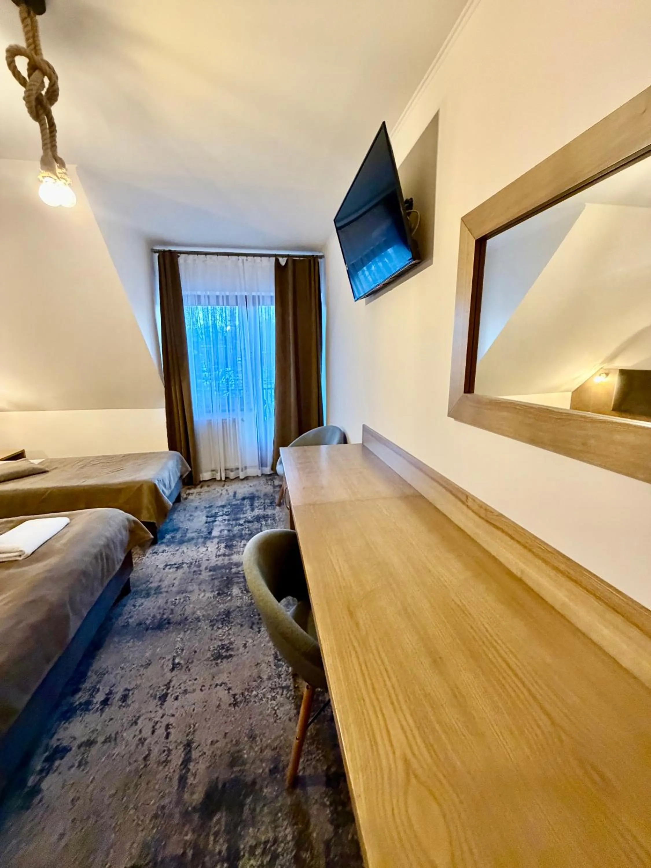 Bed in ZAJAZD BIAŁCZAŃSKI Dom Wypoczynkowy Restauracja