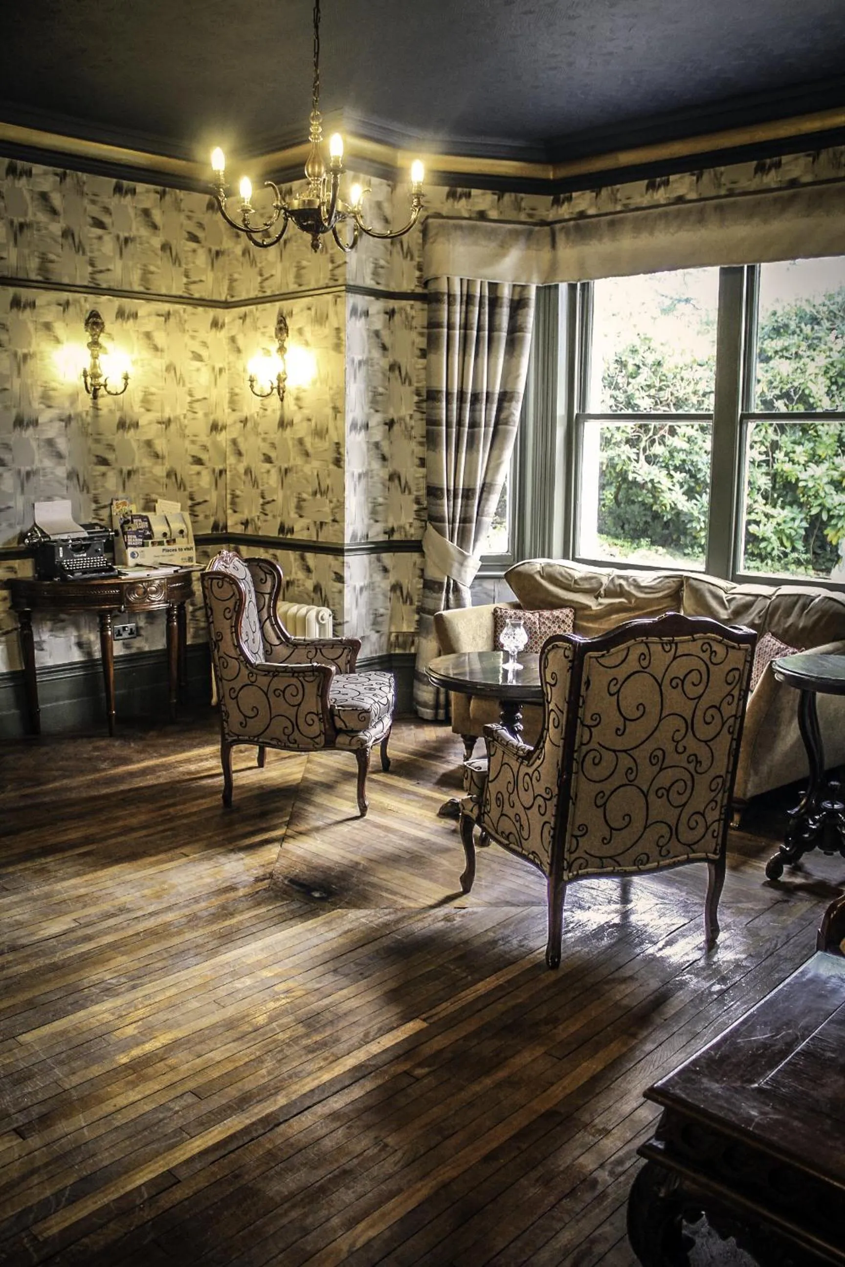 Communal lounge/ TV room in Brook Hall Hotel