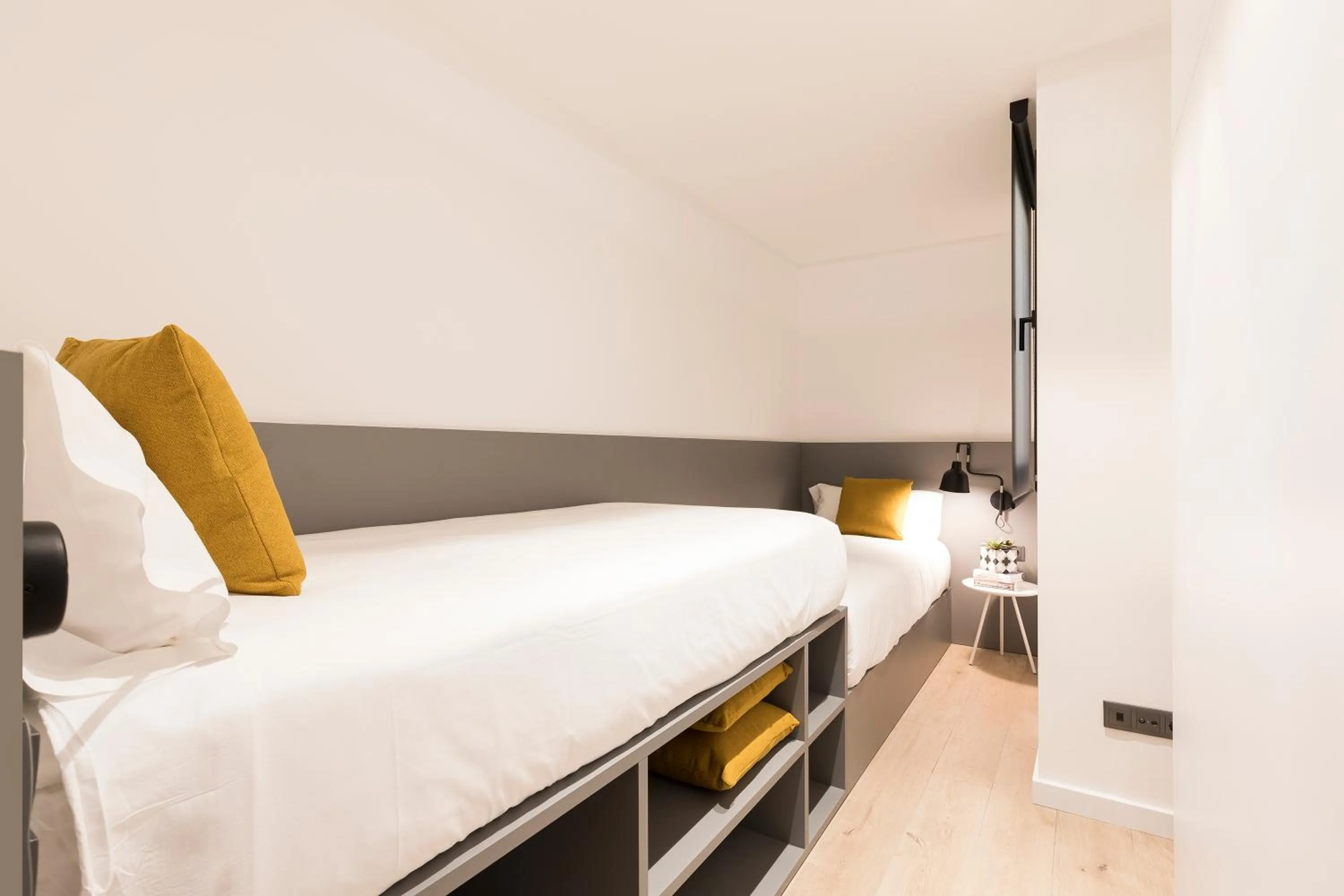 Bed in Aspasios Sagrada Familia Apartments