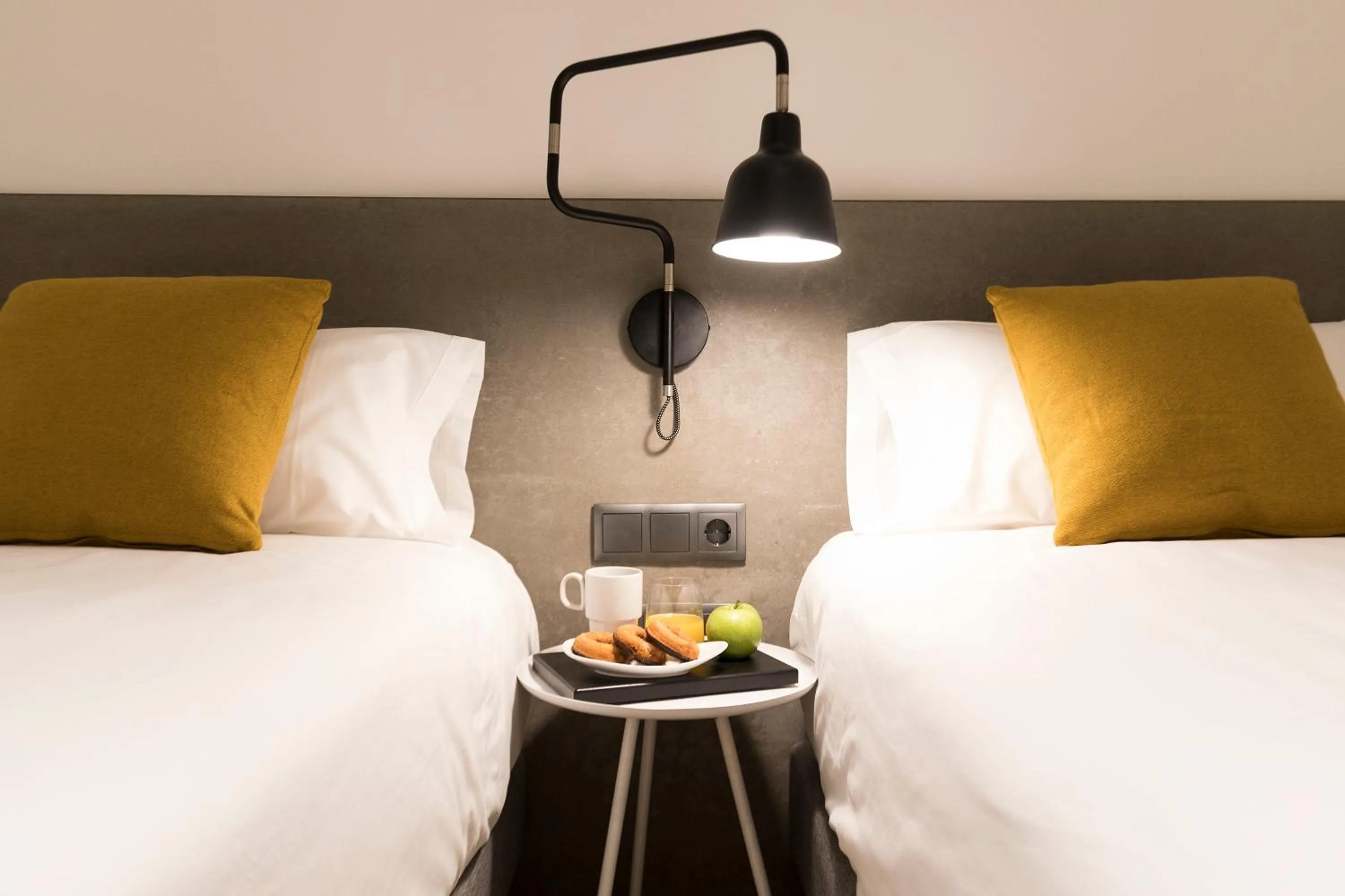 Bed in Aspasios Sagrada Familia Apartments