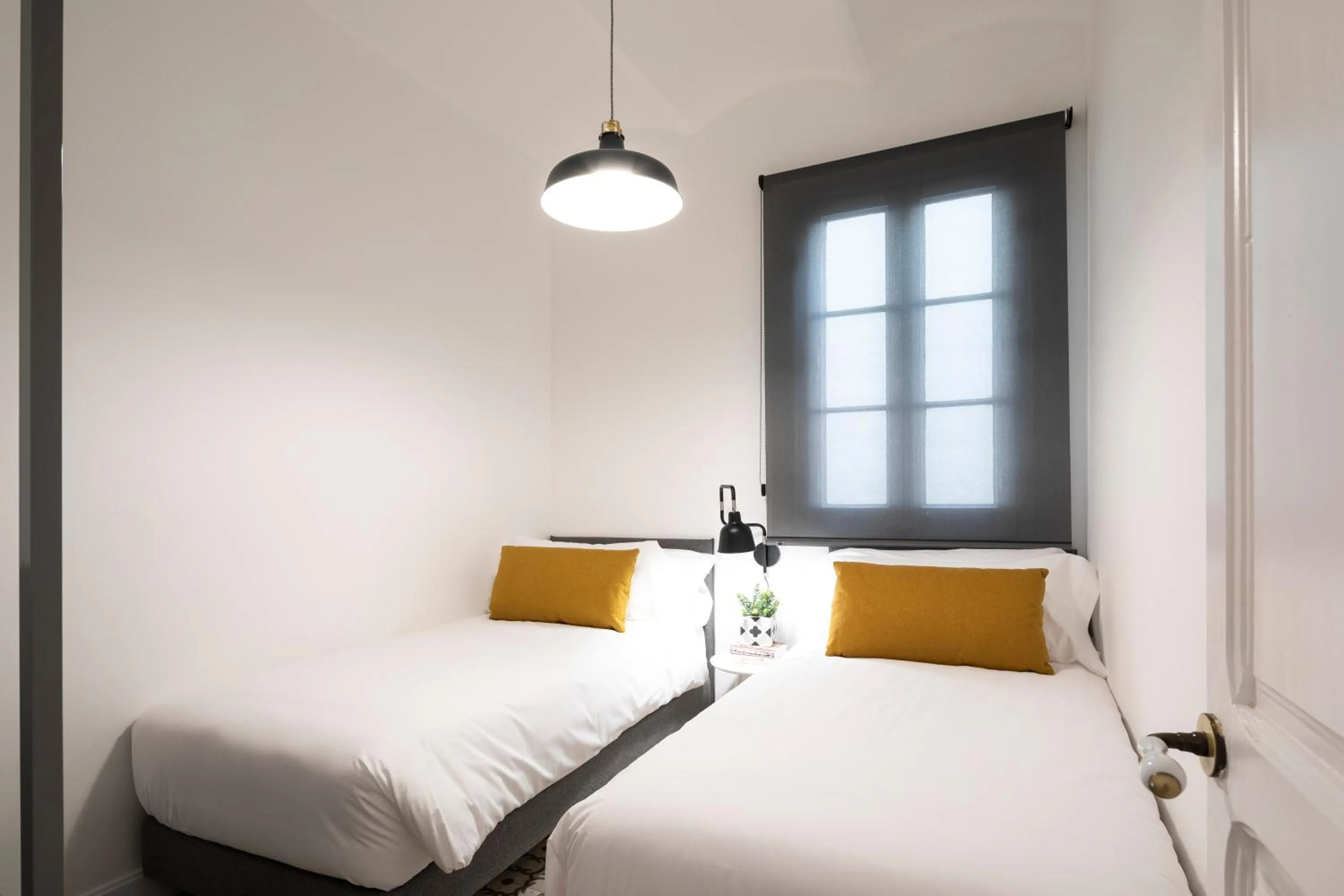 Bed in Aspasios Sagrada Familia Apartments