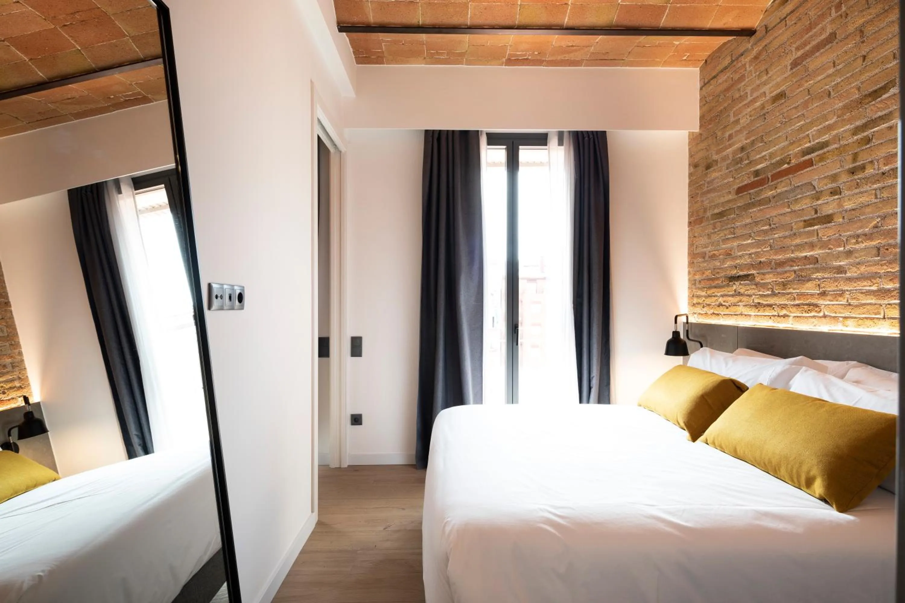 Bed in Aspasios Sagrada Familia Apartments