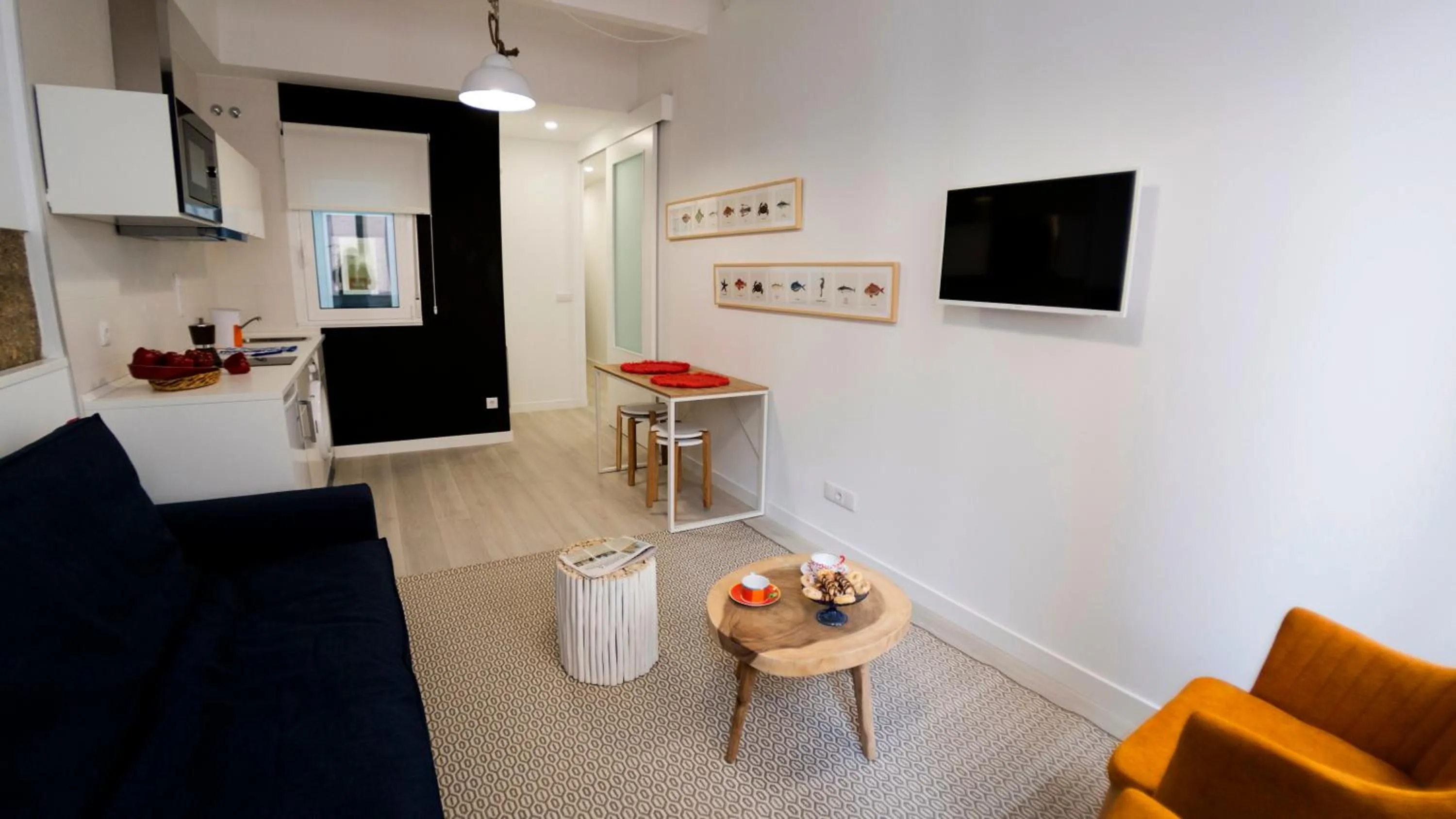 Living room, TV/Entertainment Center in El Faro de Pepa by Como en Casa