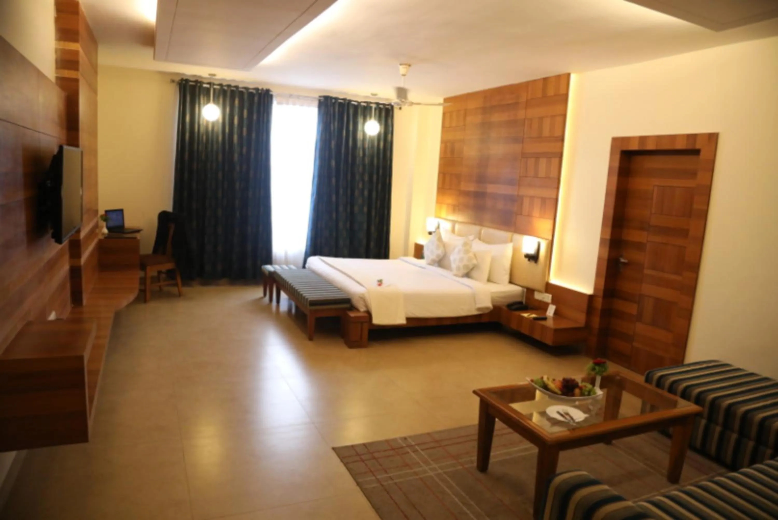 Bed in Hotel Kanha’s Palm Springs