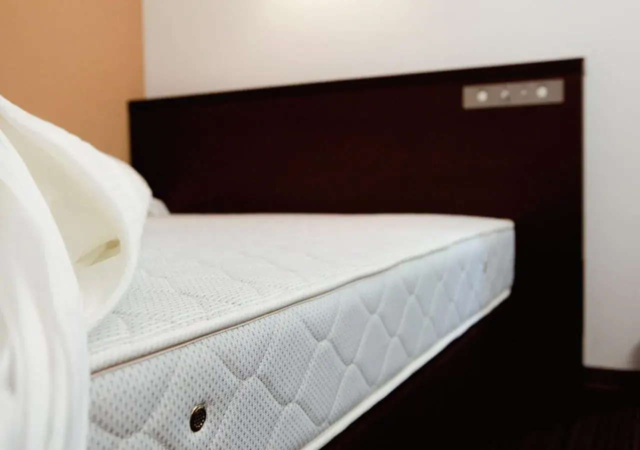 Bed in AB Hotel Kyoto Shijo Horikawa Bed in AB Hotel Kyoto Shijo Horikawa