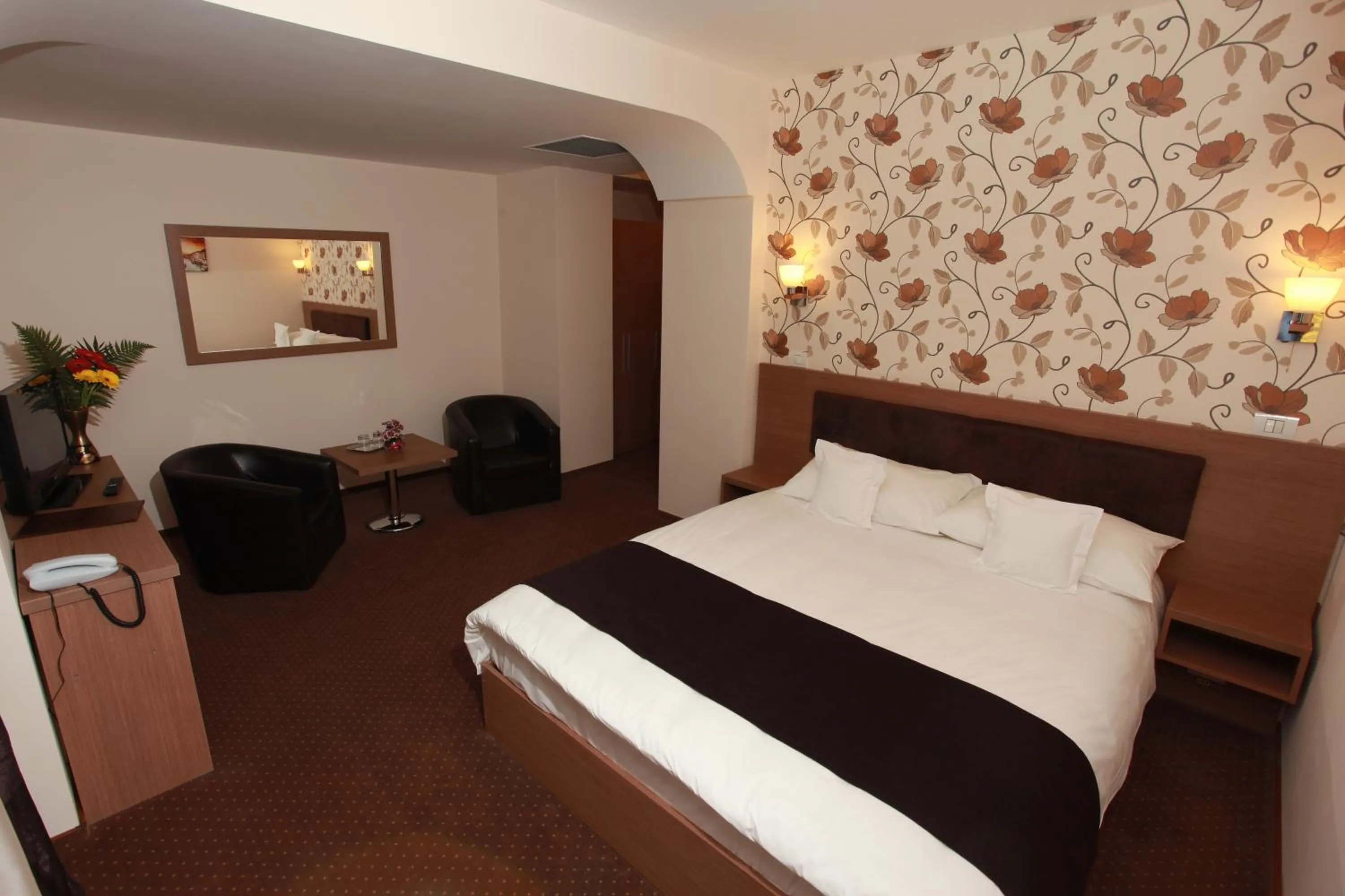 Bed in West Plaza Hotel