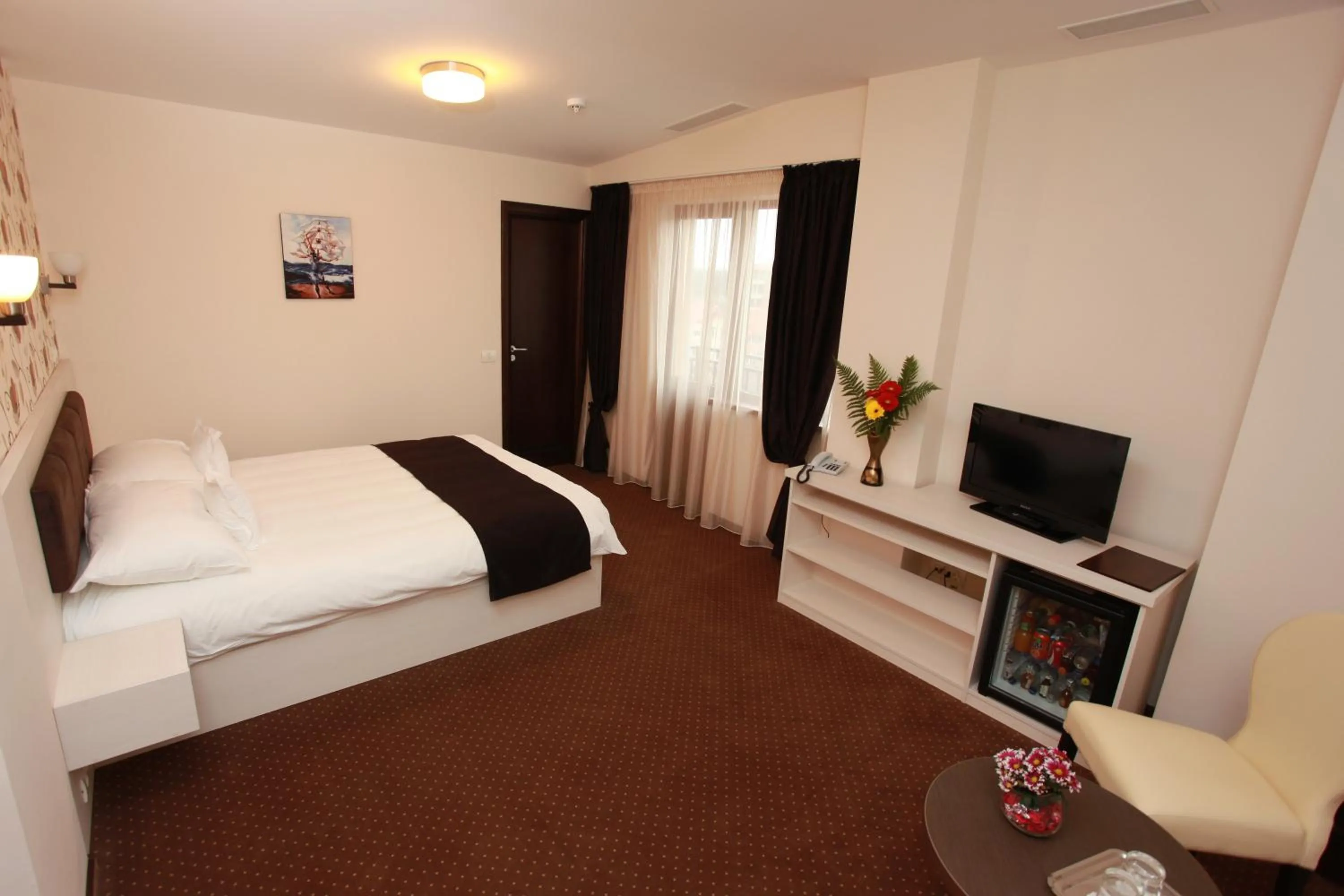 Bed in West Plaza Hotel