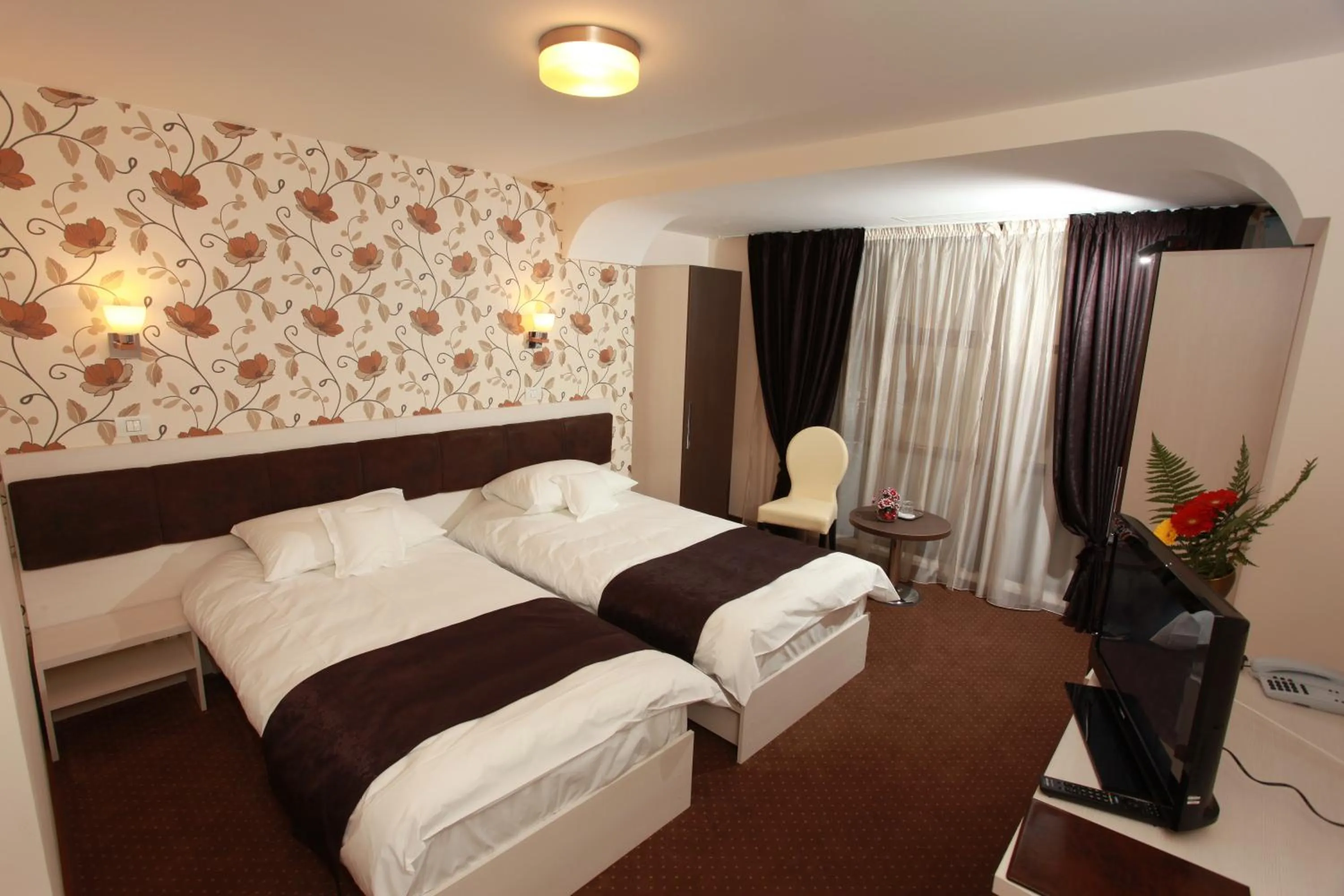 Bed in West Plaza Hotel