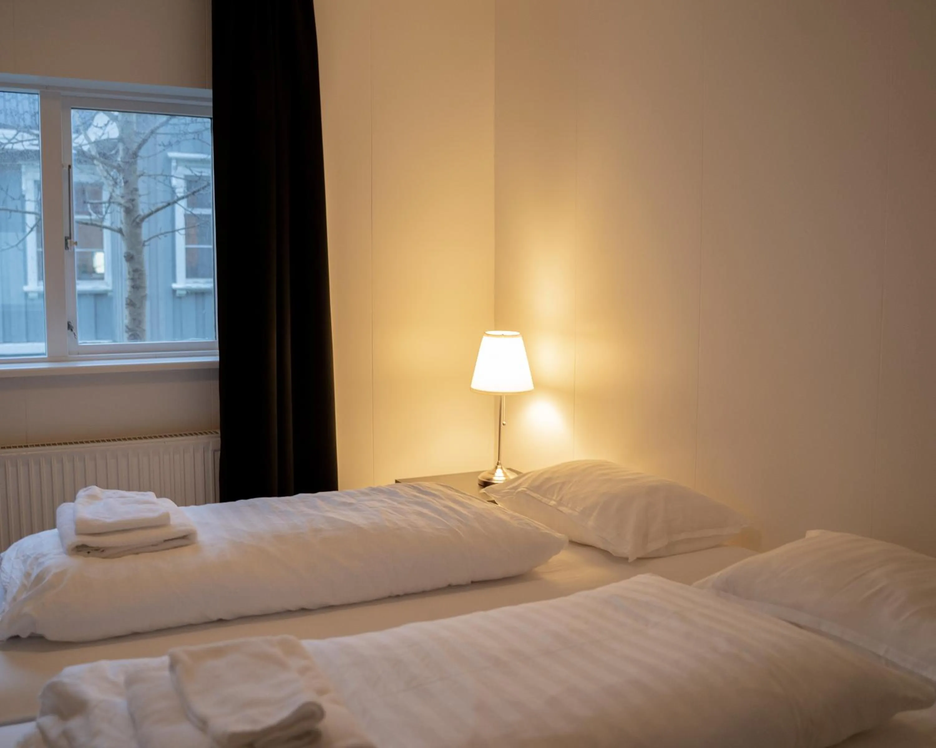 Bed in Fisherman Guesthouse Sudureyri