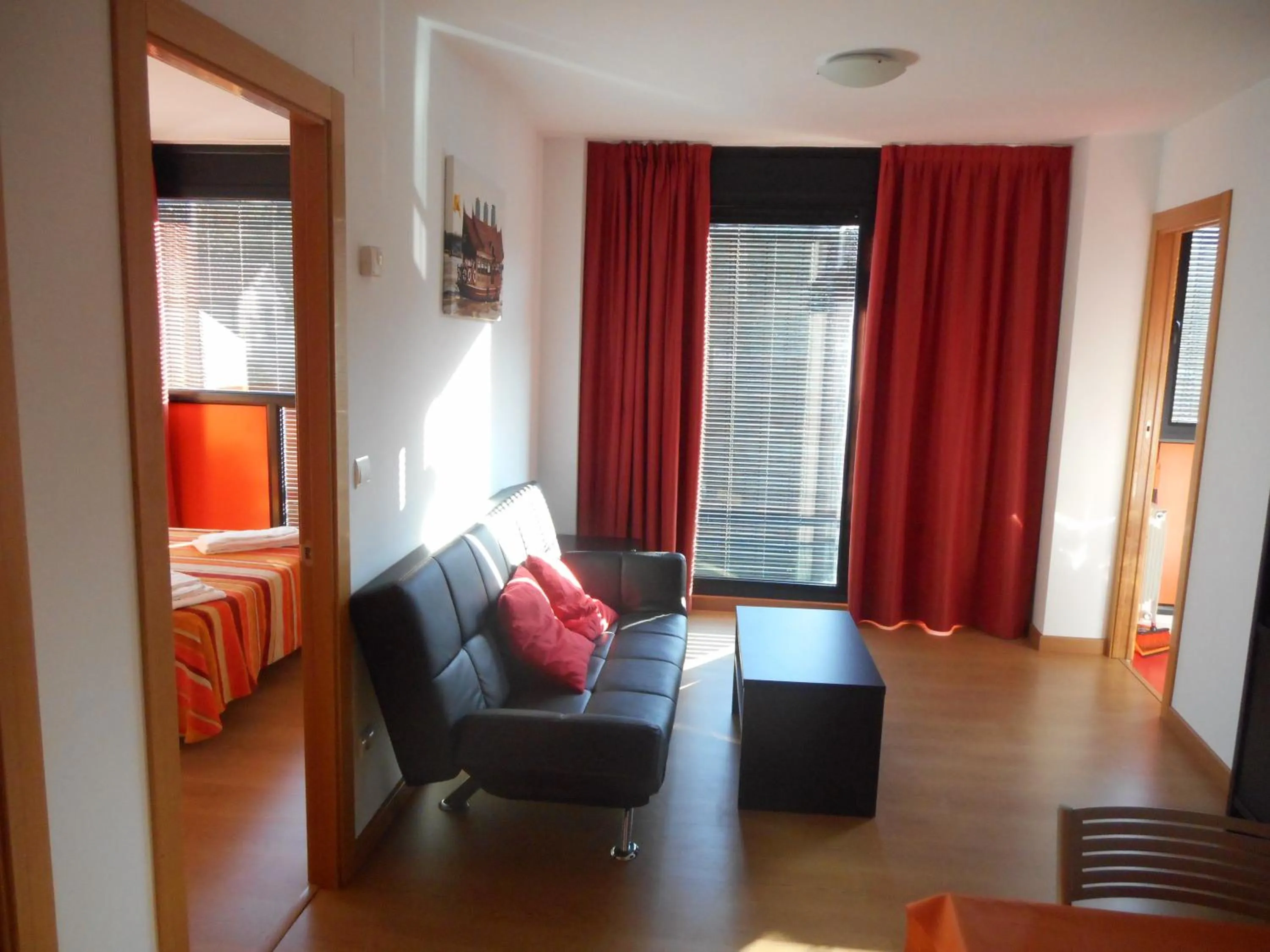 Living room, Bed in Apartamentos Bahía de Boó