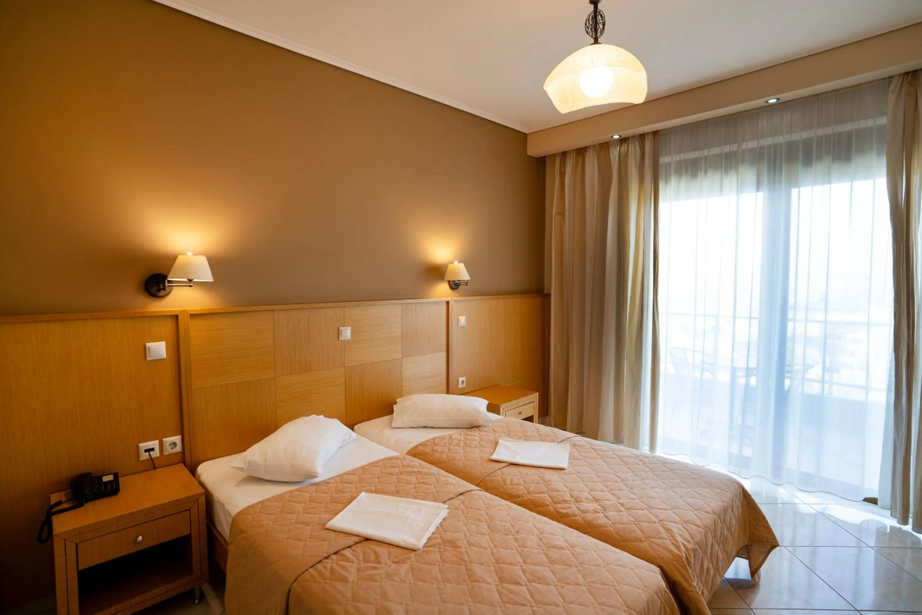 Bed in Evia Hotel & Suites