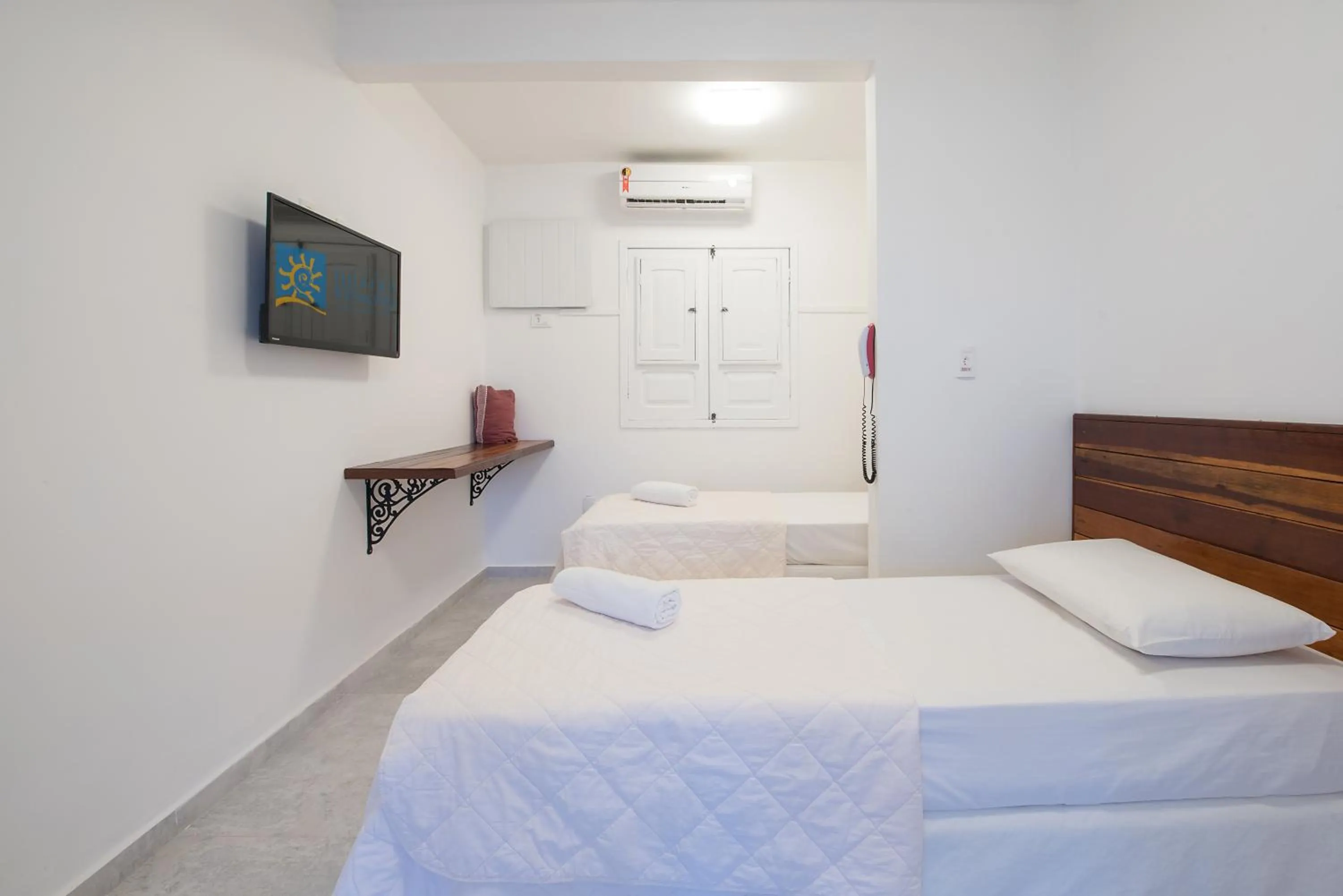 Bed in Pousada Quatro Estações