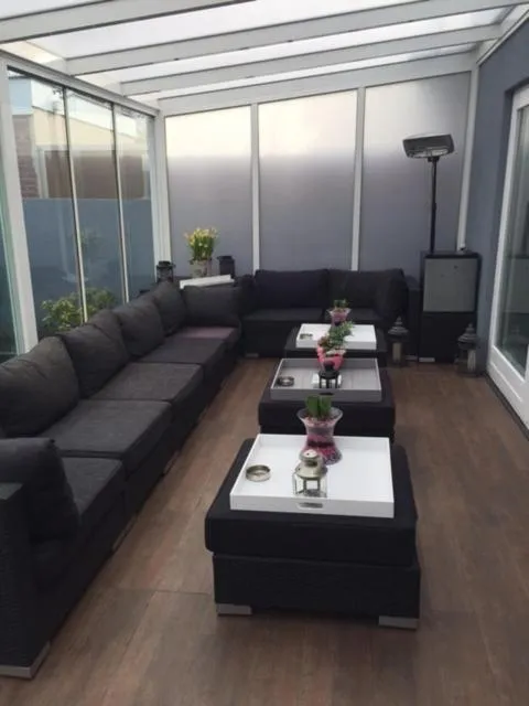 Communal lounge/ TV room in Alex Rooms