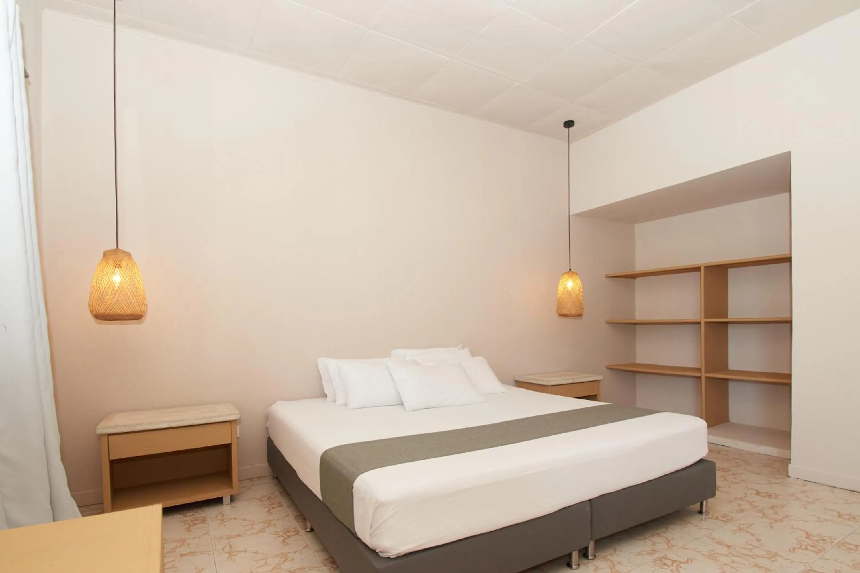 Bed in La Iguana de Santa Fe by Bernalo Hotels