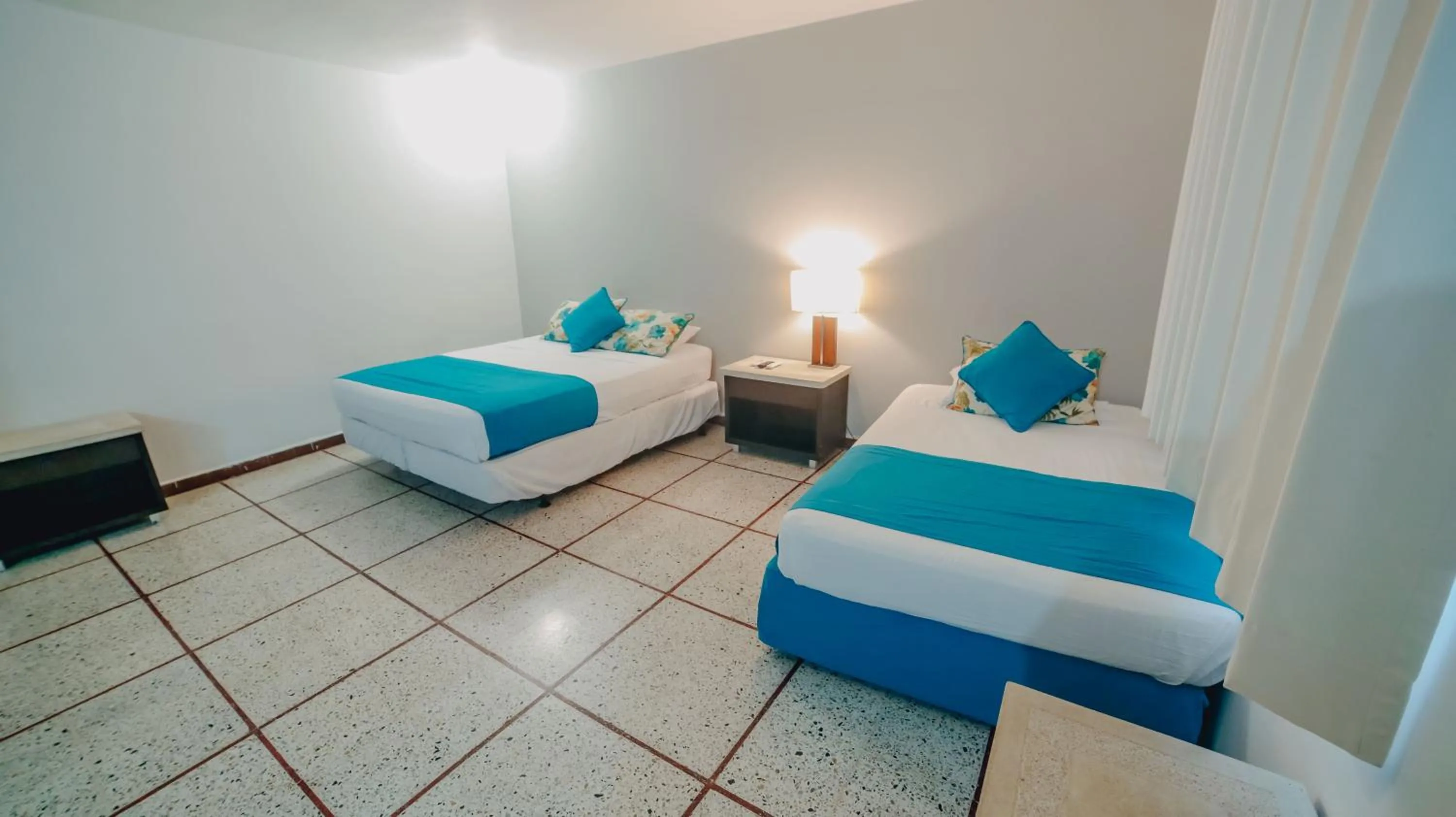 Bed in La Iguana de Santa Fe by Bernalo Hotels