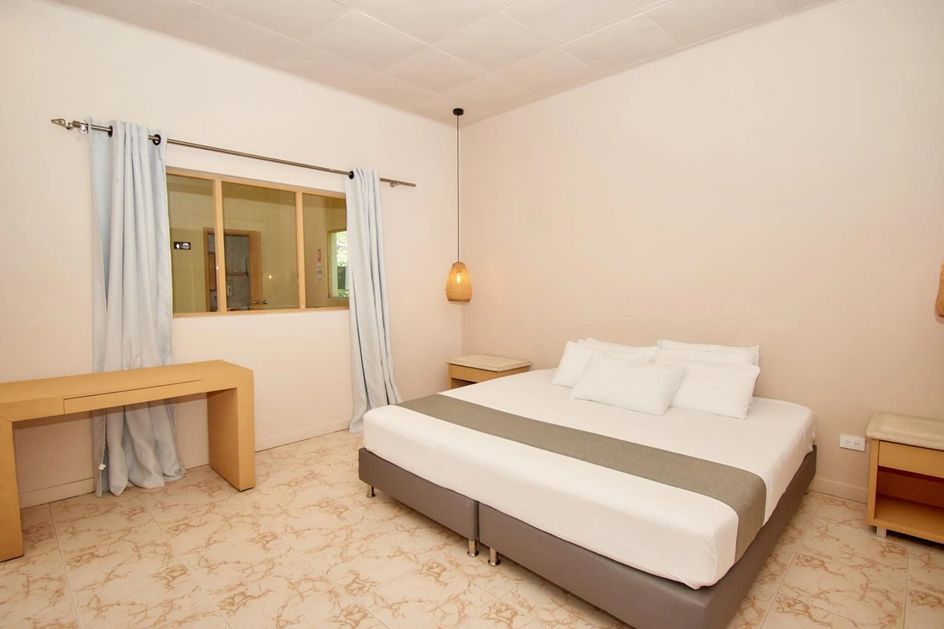 Bed in La Iguana de Santa Fe by Bernalo Hotels