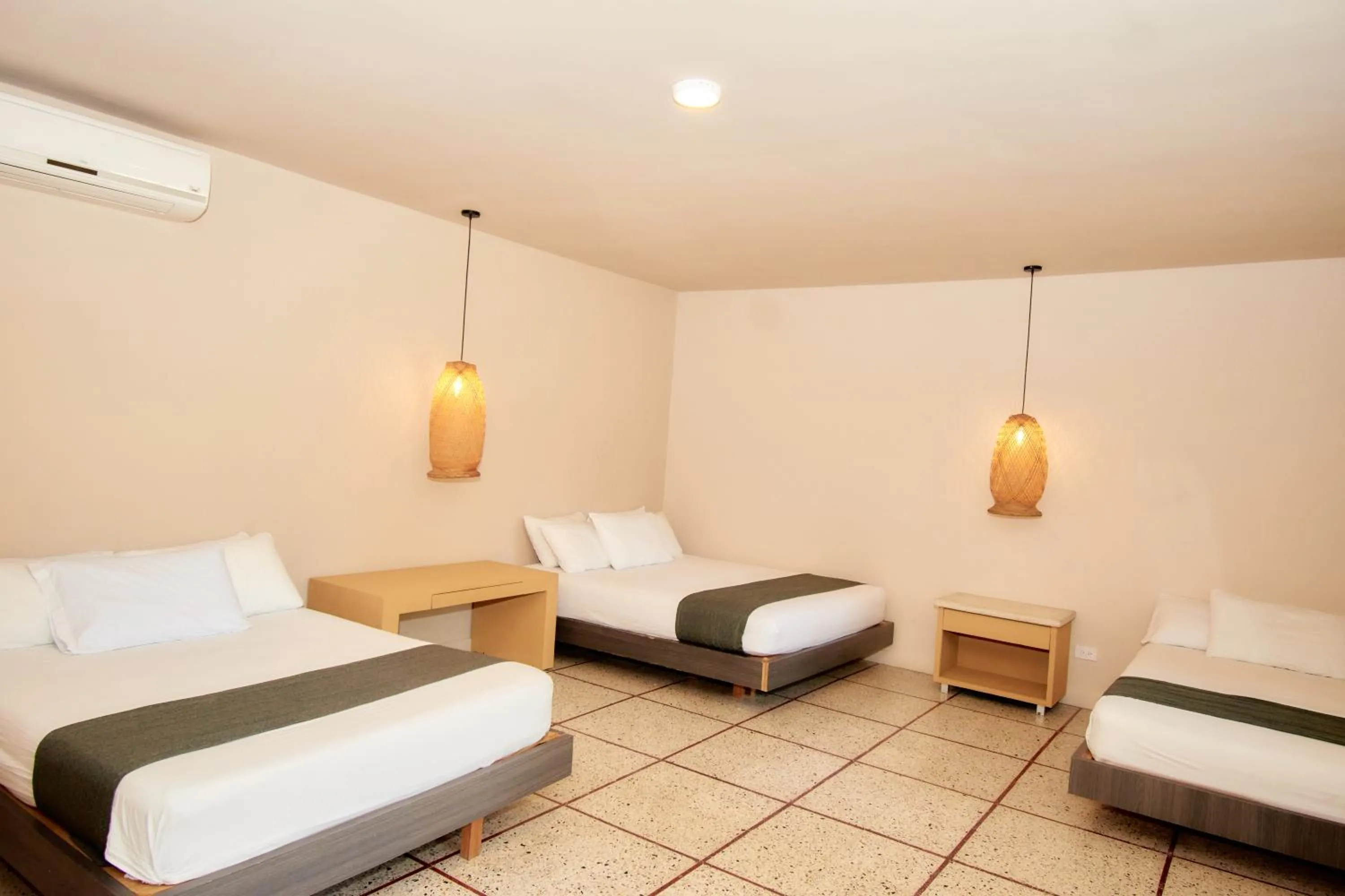 Bed in La Iguana de Santa Fe by Bernalo Hotels