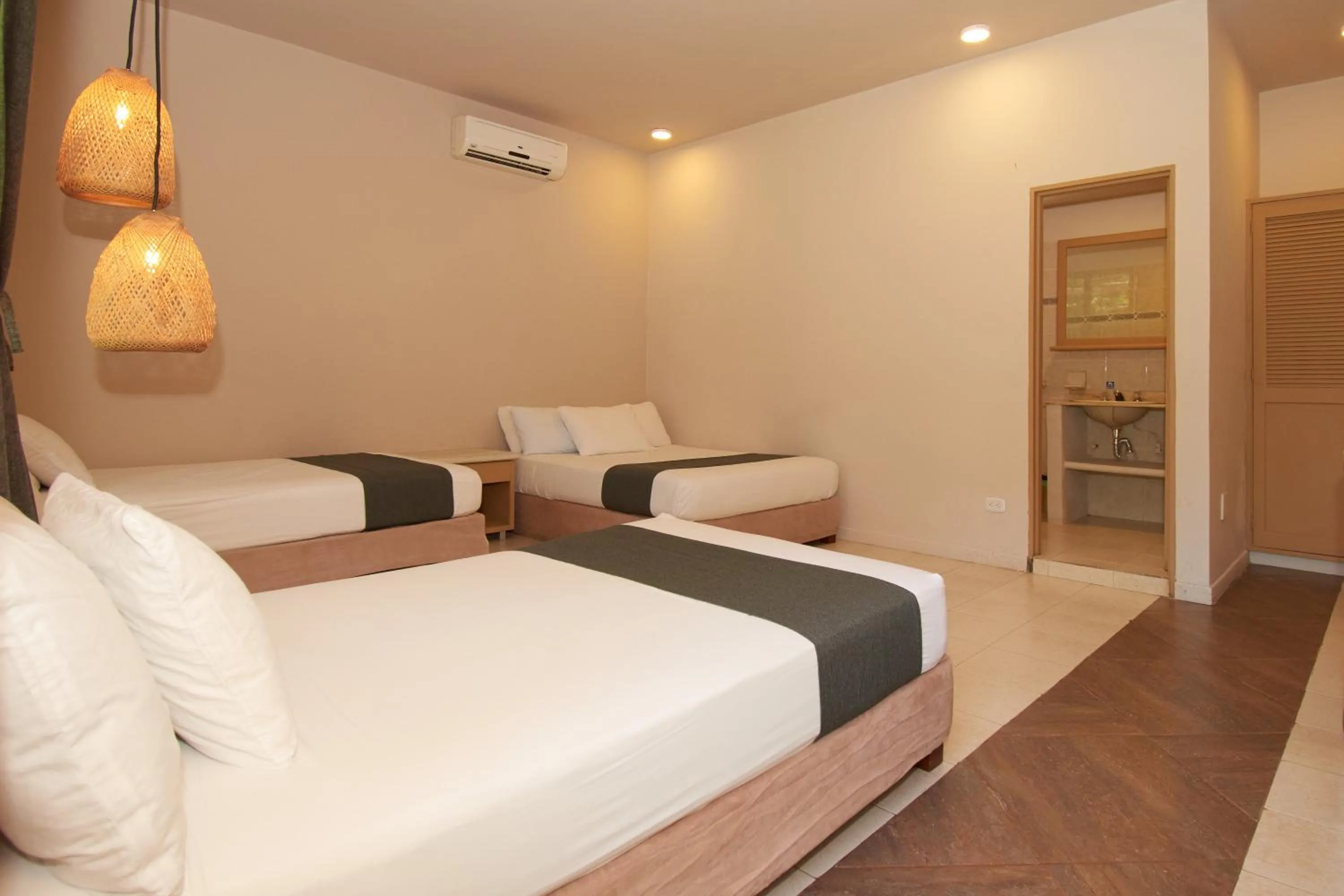 Bed in La Iguana de Santa Fe by Bernalo Hotels