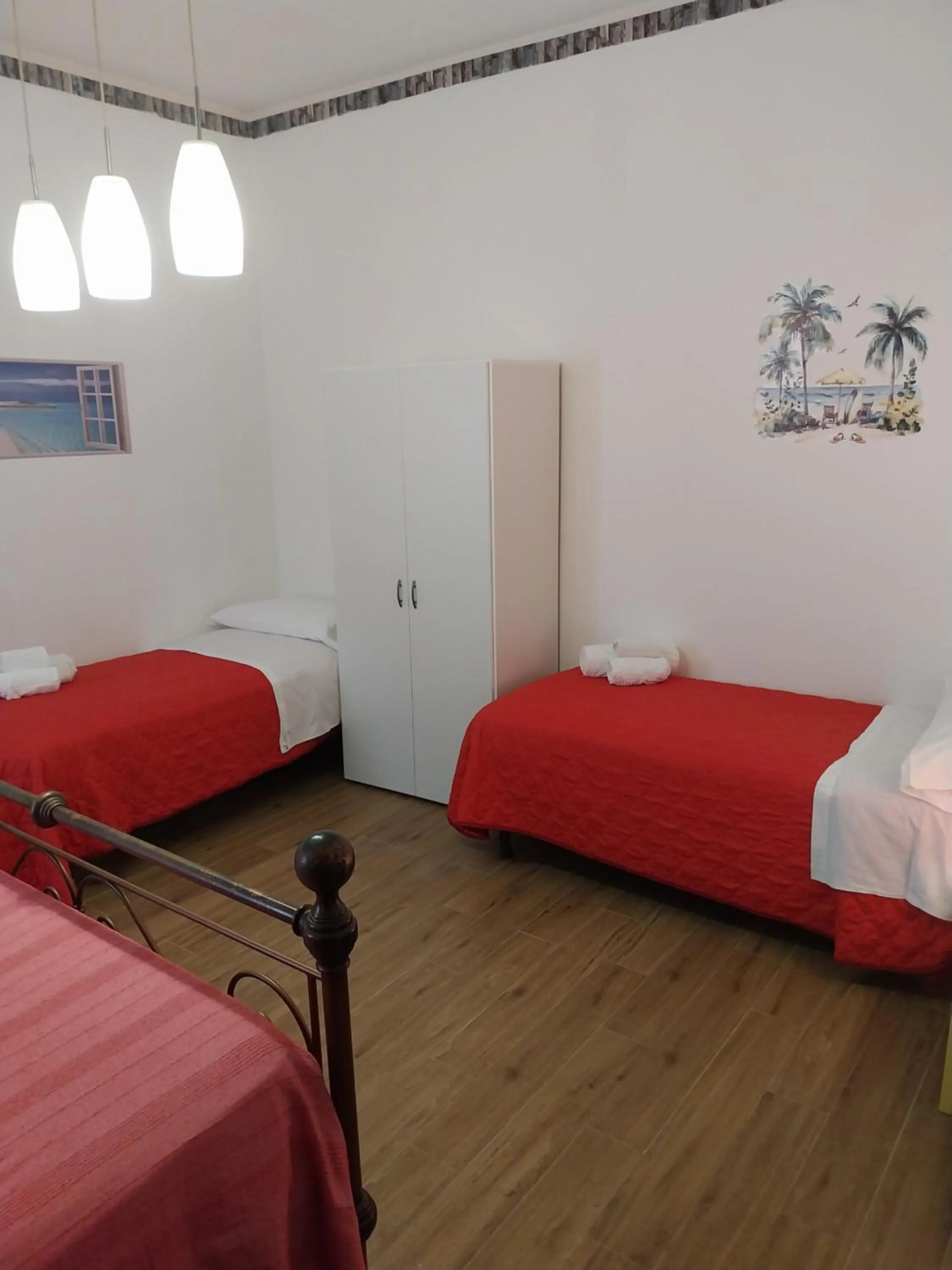 Bed in Le Rocce Holiday Rooms