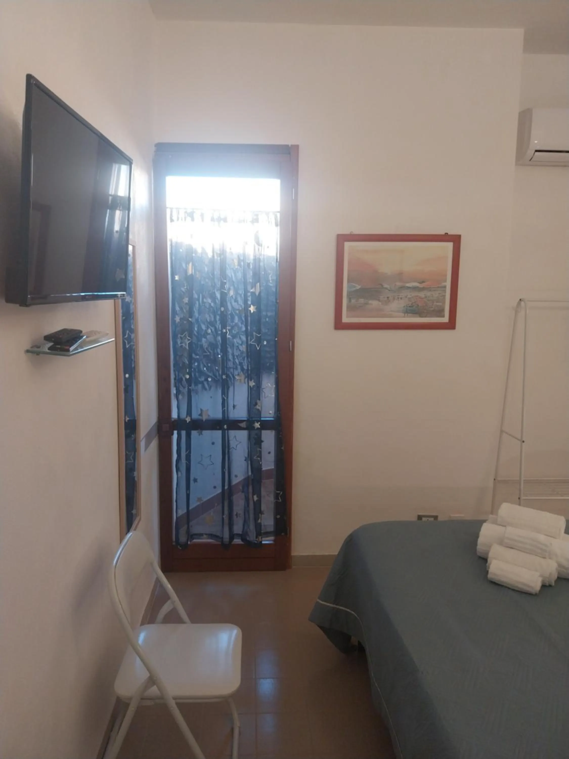 Bed in Le Rocce Holiday Rooms