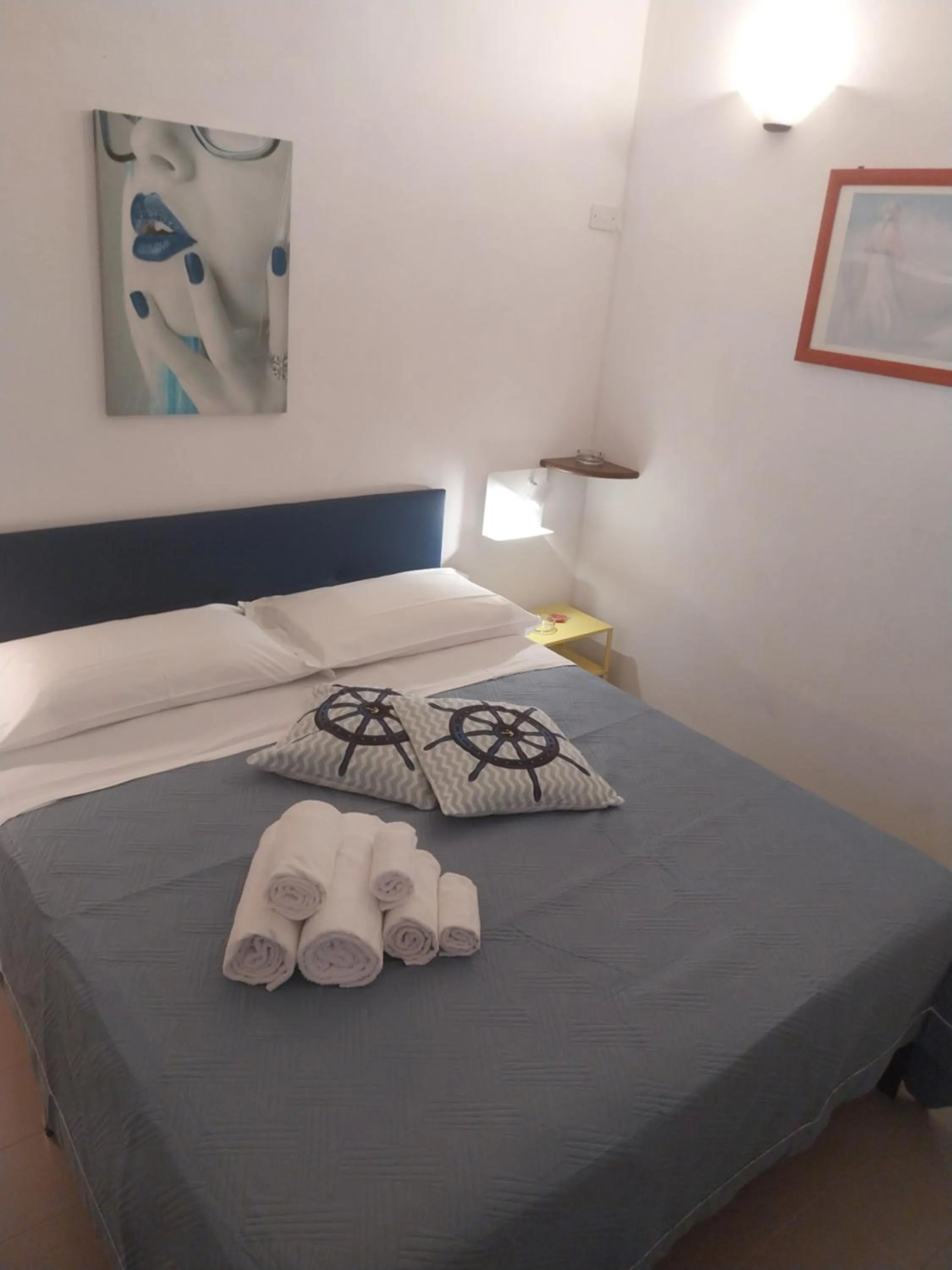 Bed in Le Rocce Holiday Rooms