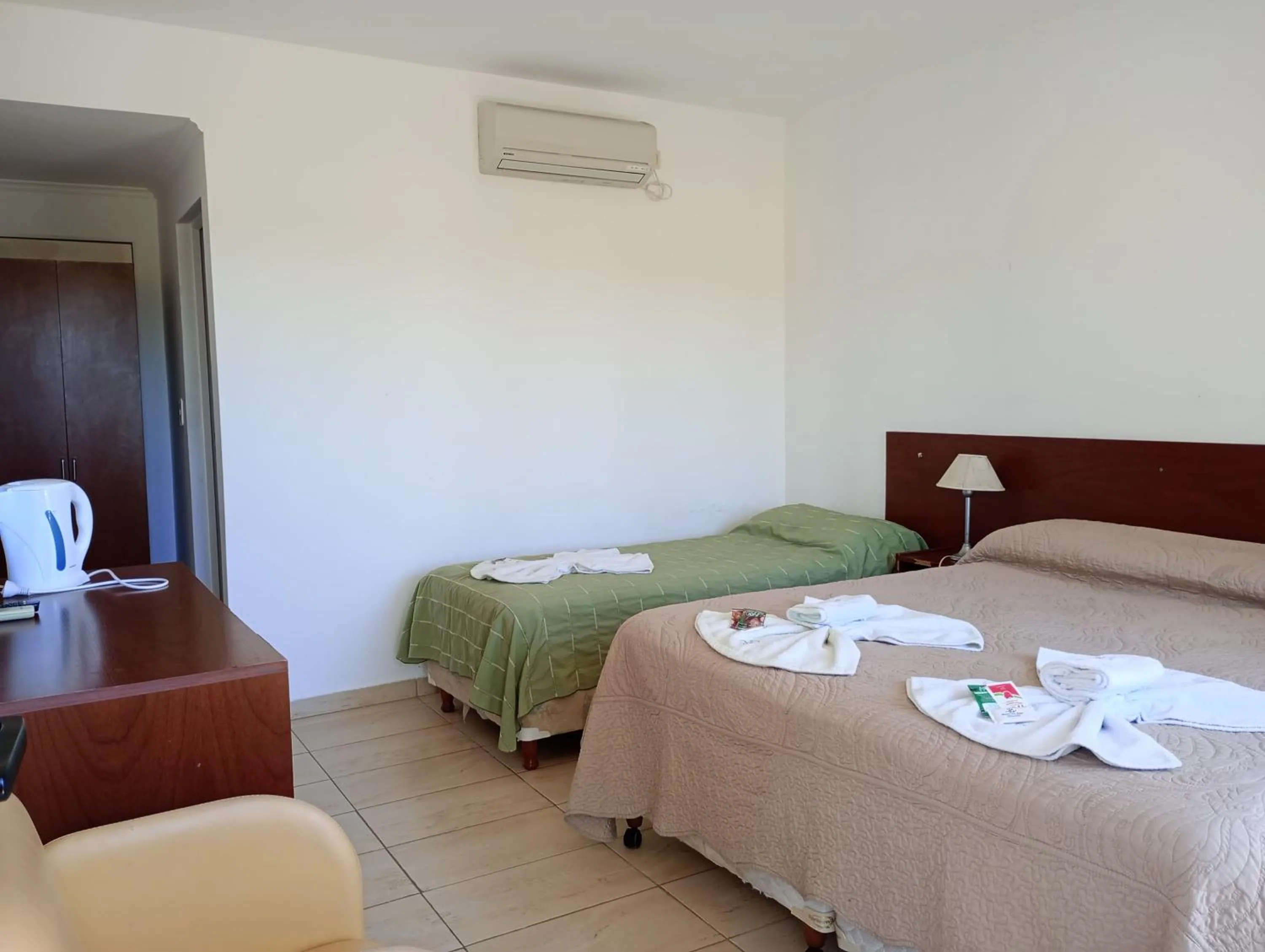 Bed in Brisas del Lago Apart y Hotel