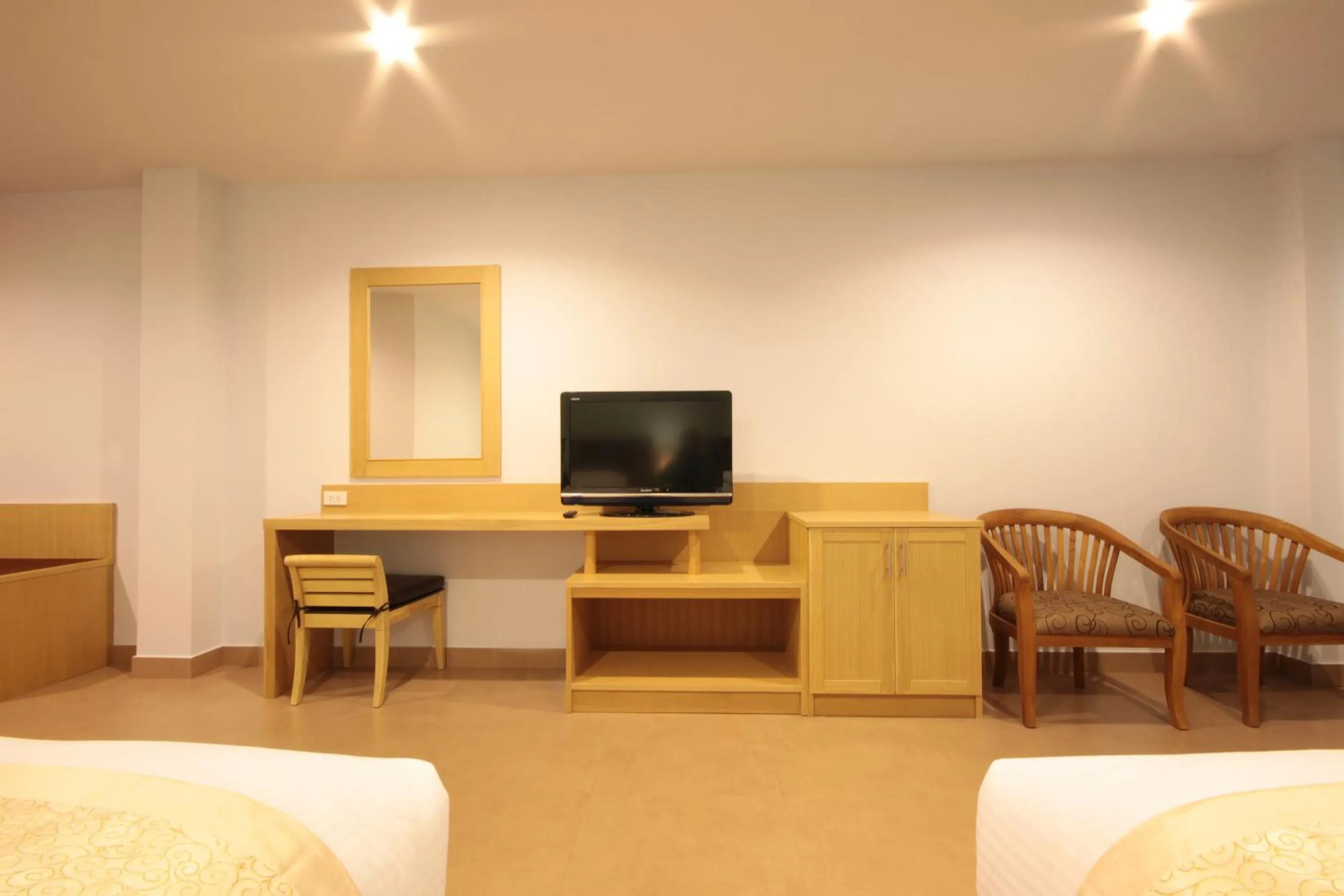 Bed in Paragon Suites Resort