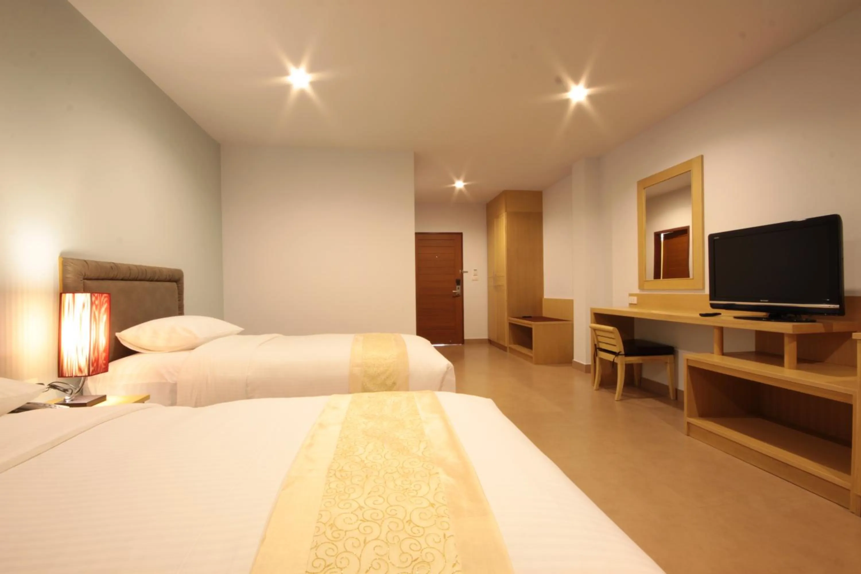 Bed in Paragon Suites Resort