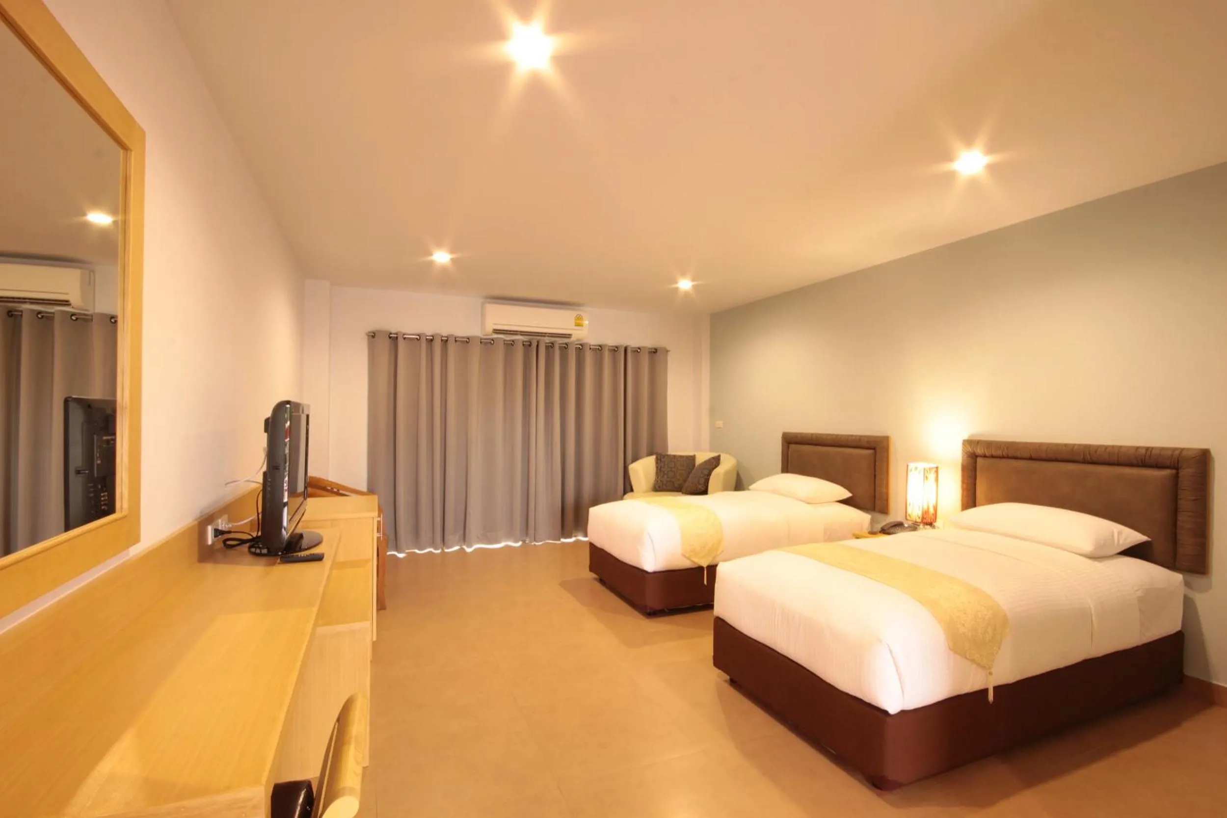 Bed in Paragon Suites Resort