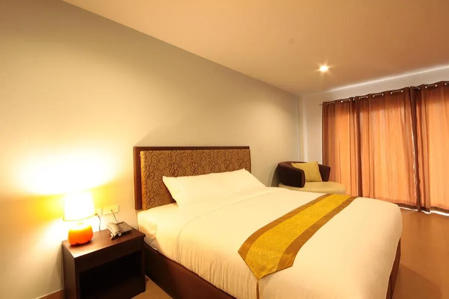 Bed in Paragon Suites Resort