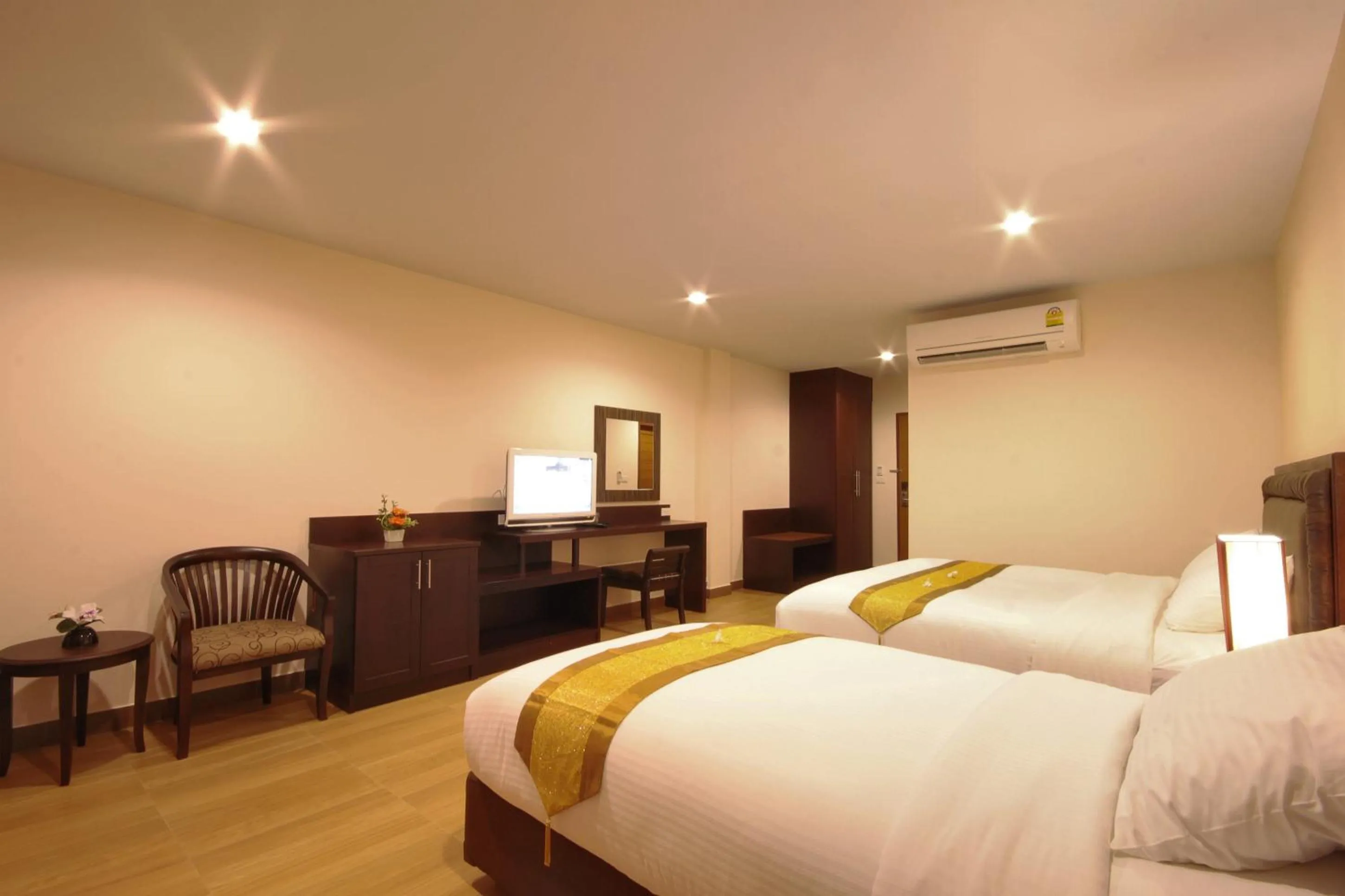 Bed in Paragon Suites Resort