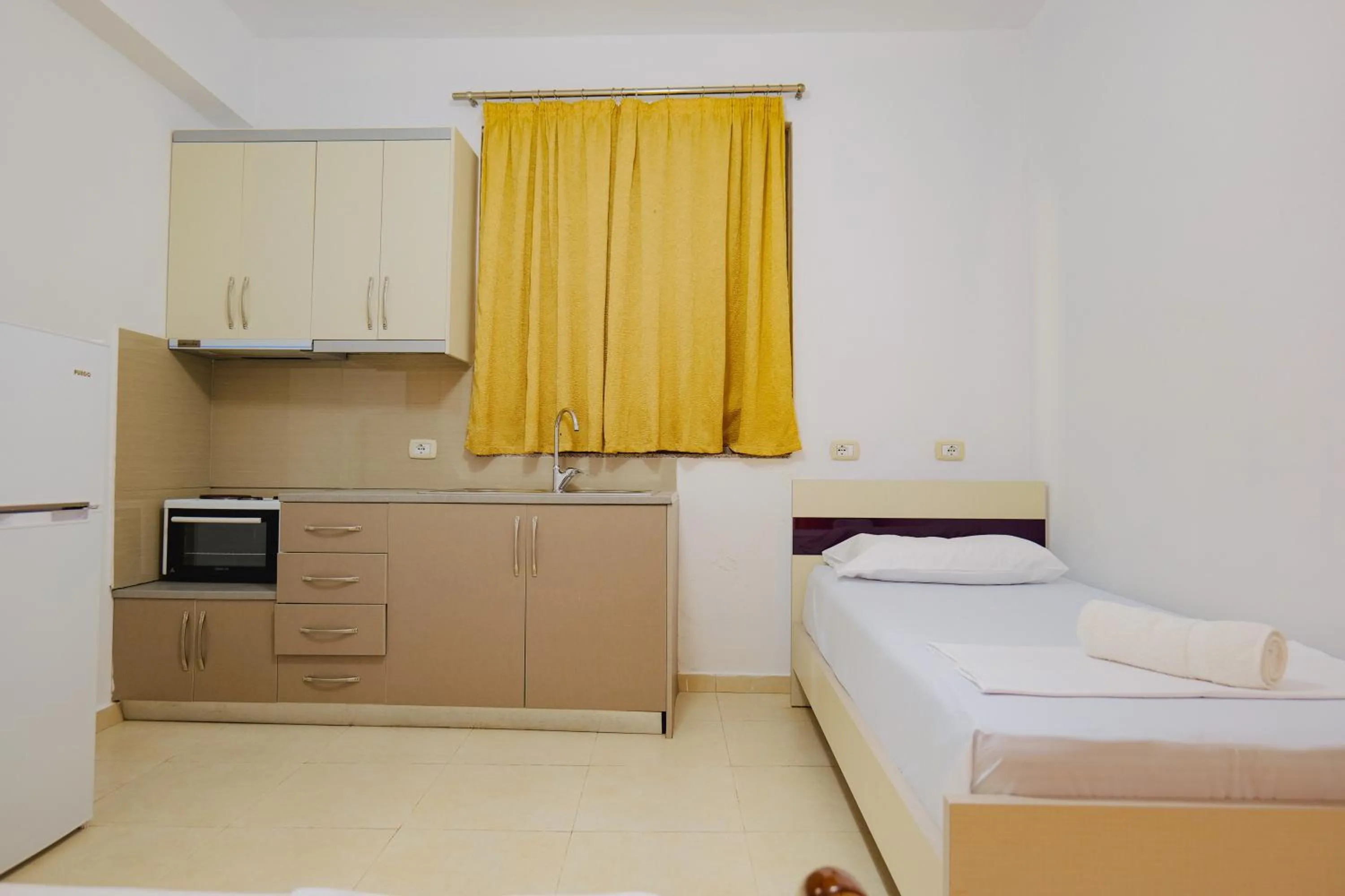 Bed in Hotel Argjiro