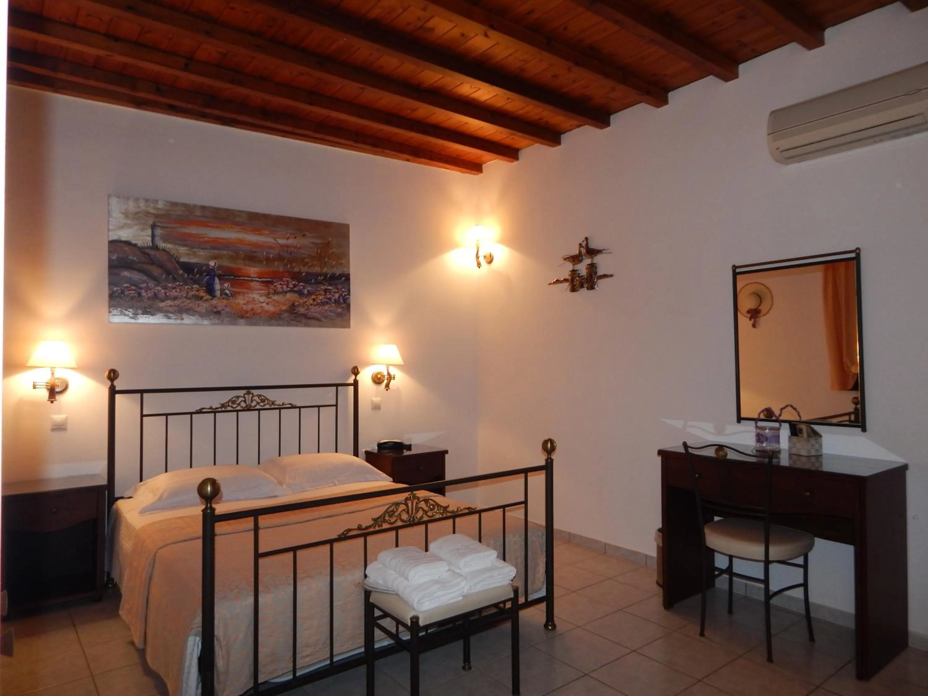 Bed in Tinos Suites & Apartments