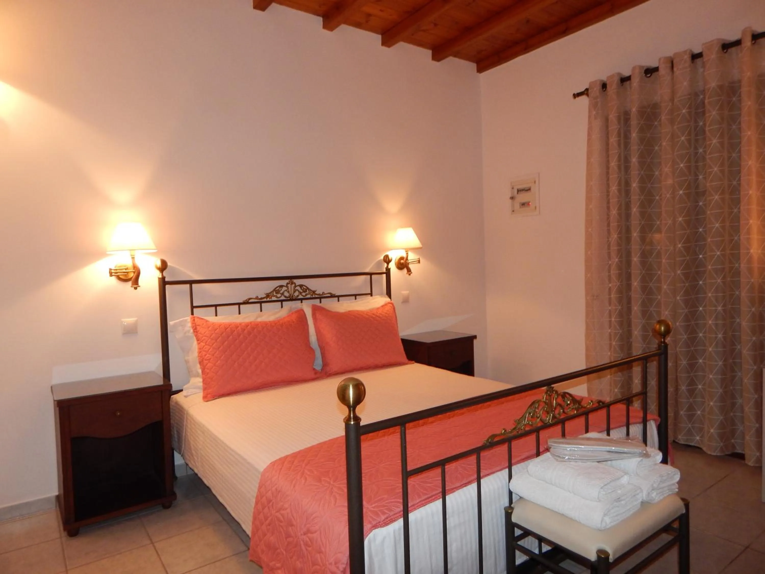 Bed in Tinos Suites & Apartments